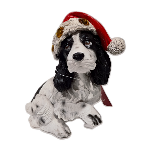 White cocker spaniel wearing red Santa hat lights up