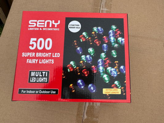 Packaging of LED string lights with colorful bulbs on a cardboard background
