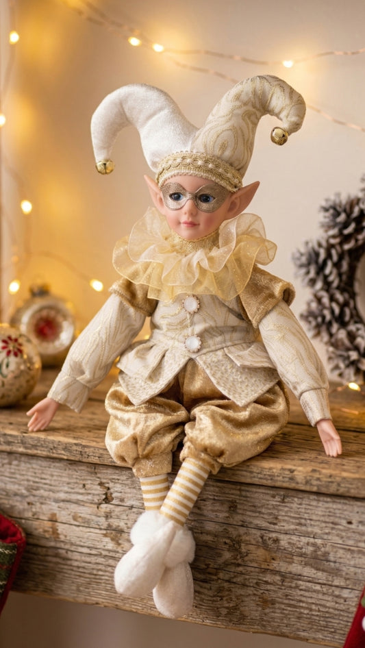 Cream and gold jester figurine with masquerade mask and curled bell-tipped hat