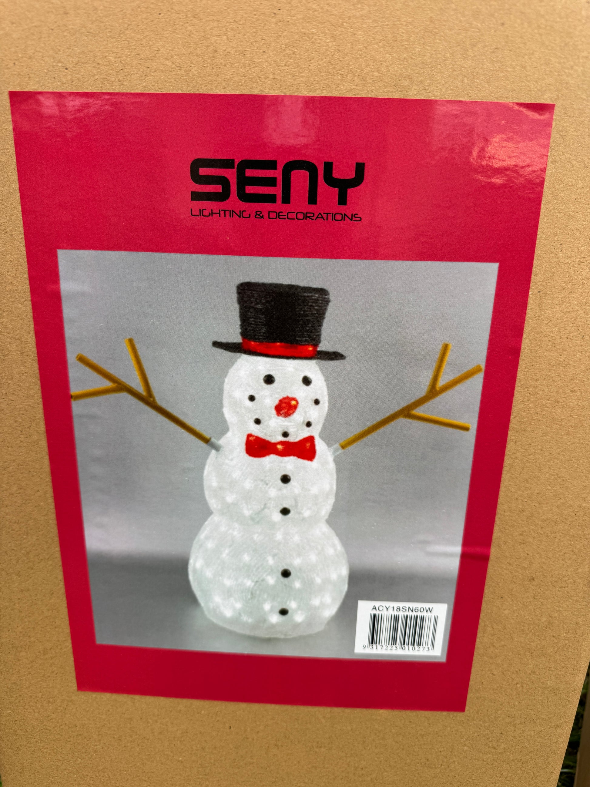 Illuminated acrylic snowman with red hat and bow tie, lit with white LED lights
