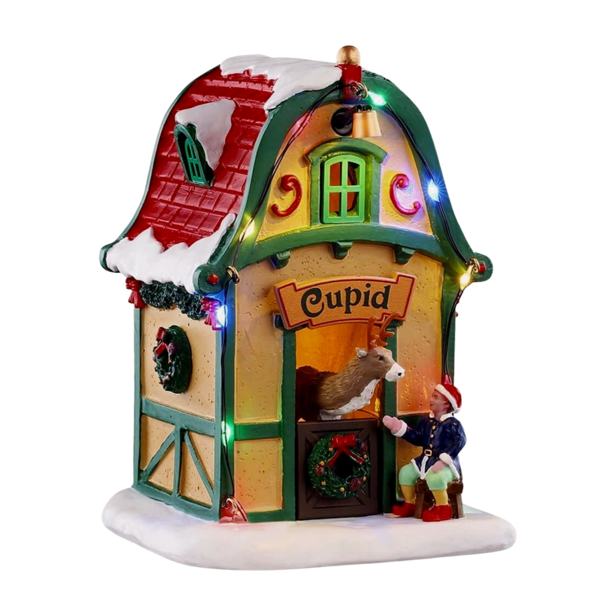 Front of Cupid's reindeer stable village building with lit interior, Cupid sign, reindeer in doorway, and elf figurine
