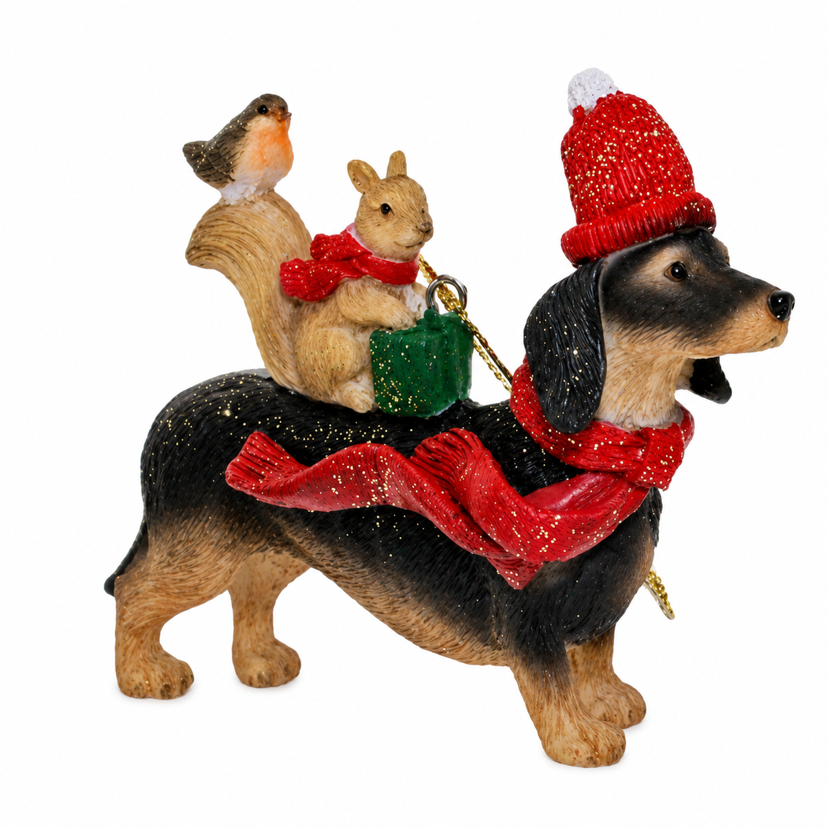 Dachshund Christmas tree decoration in a red bobble hat and scarf carrying a squirrel with gift and a perched robin