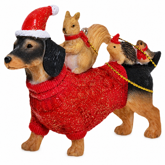 Dachshund tree decoration in red glitter jumper and Santa hat with squirrel, hedgehog and robin passengers on his back