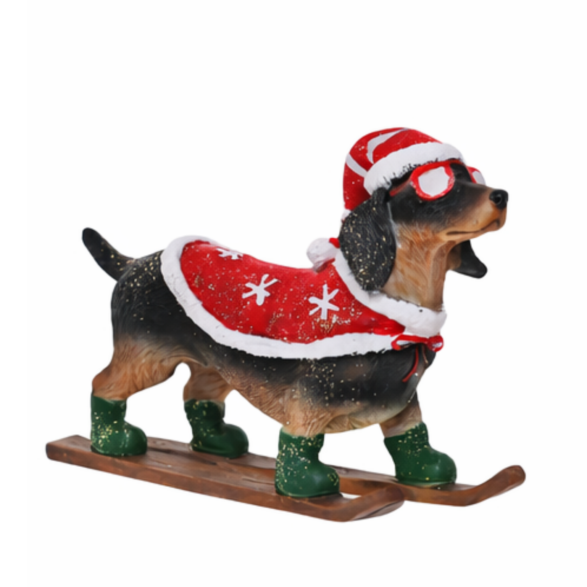 Dachshund Christmas tree decoration on skis wearing a red snowflake cape, Santa hat with goggles and green boots