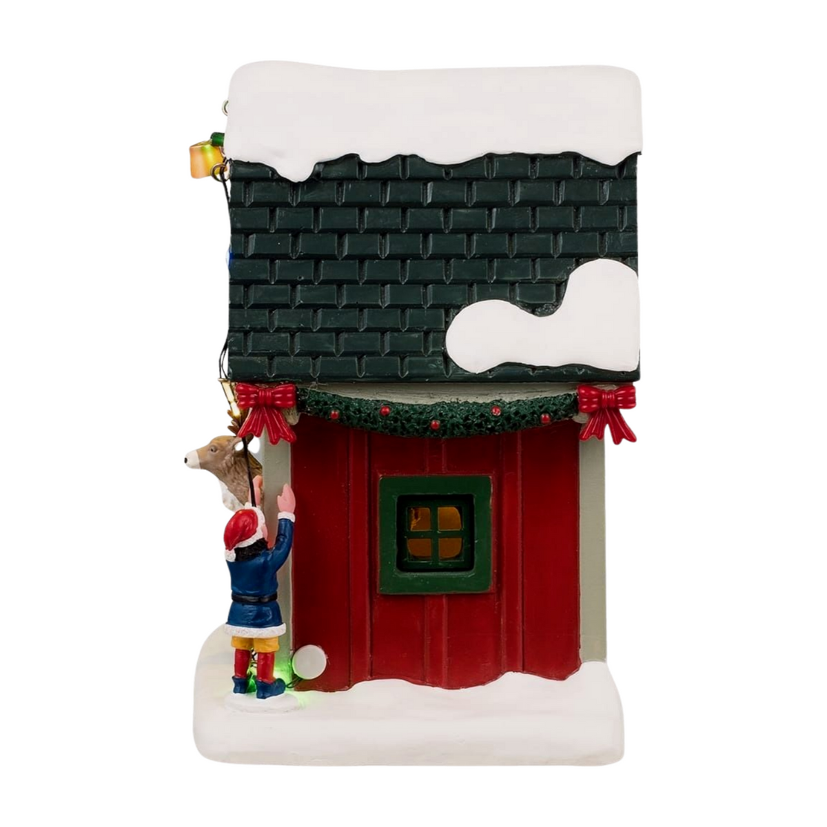 Left view of Lemax Dasher's reindeer stable showing elf figurine hanging lights, reindeer, garland, and lit window