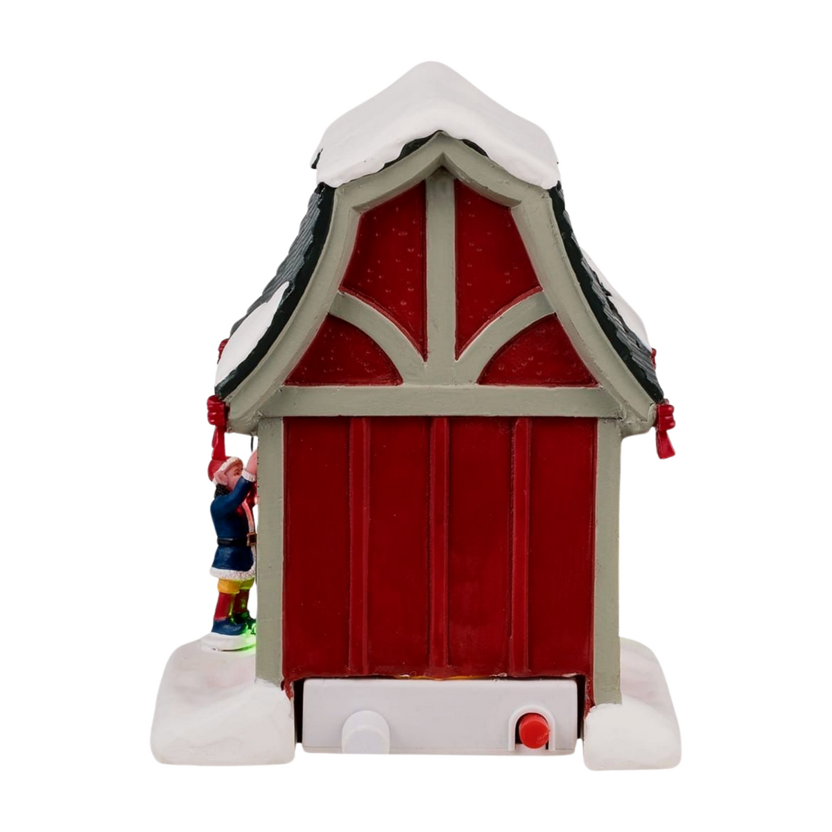 Back view of Lemax Dasher's reindeer stable showing red barn-style doors, arched detail, elf figurine, and power button base
