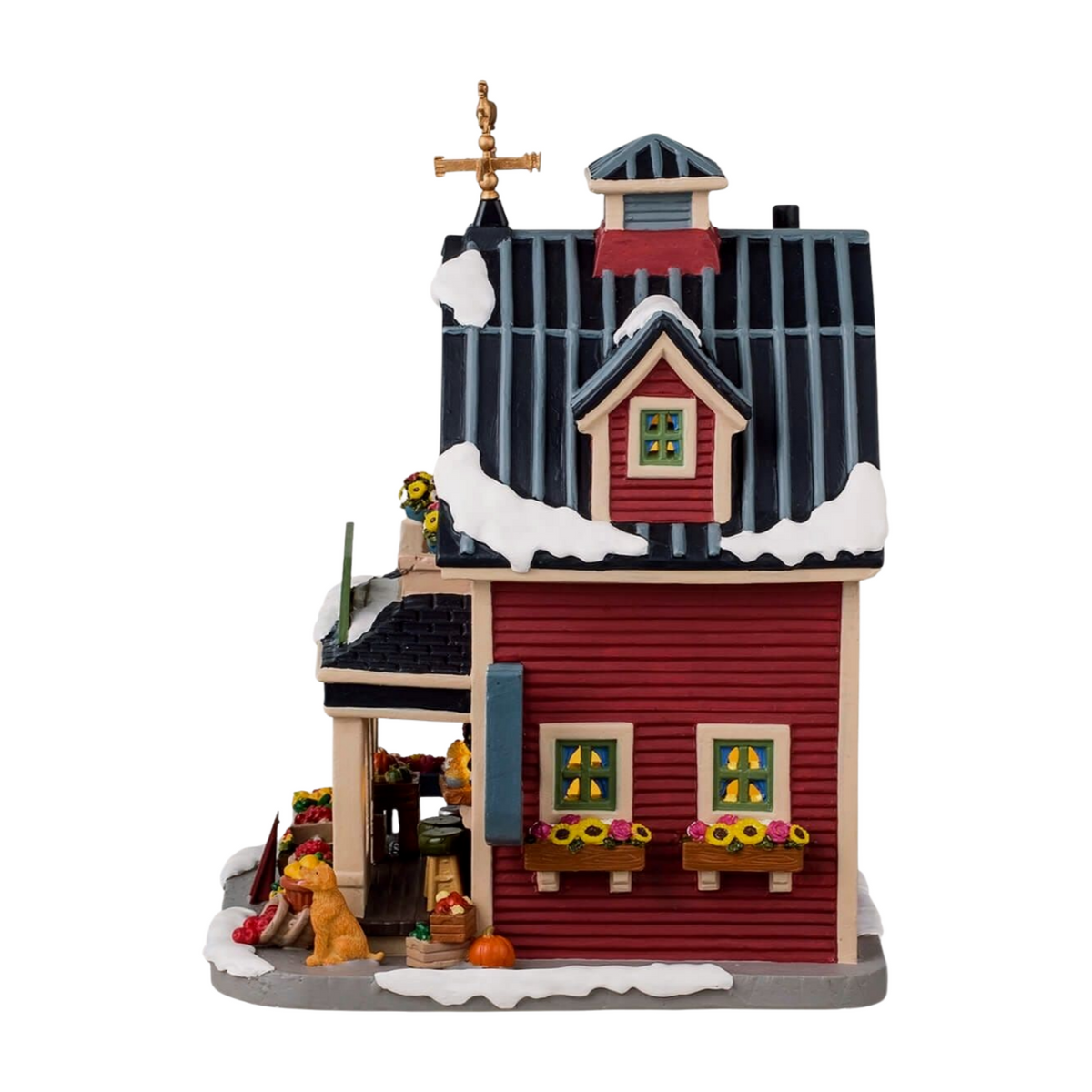 Left view of red farm building Christmas village with flower boxes, produce crates, dog figurine, and gold weather vane on roof