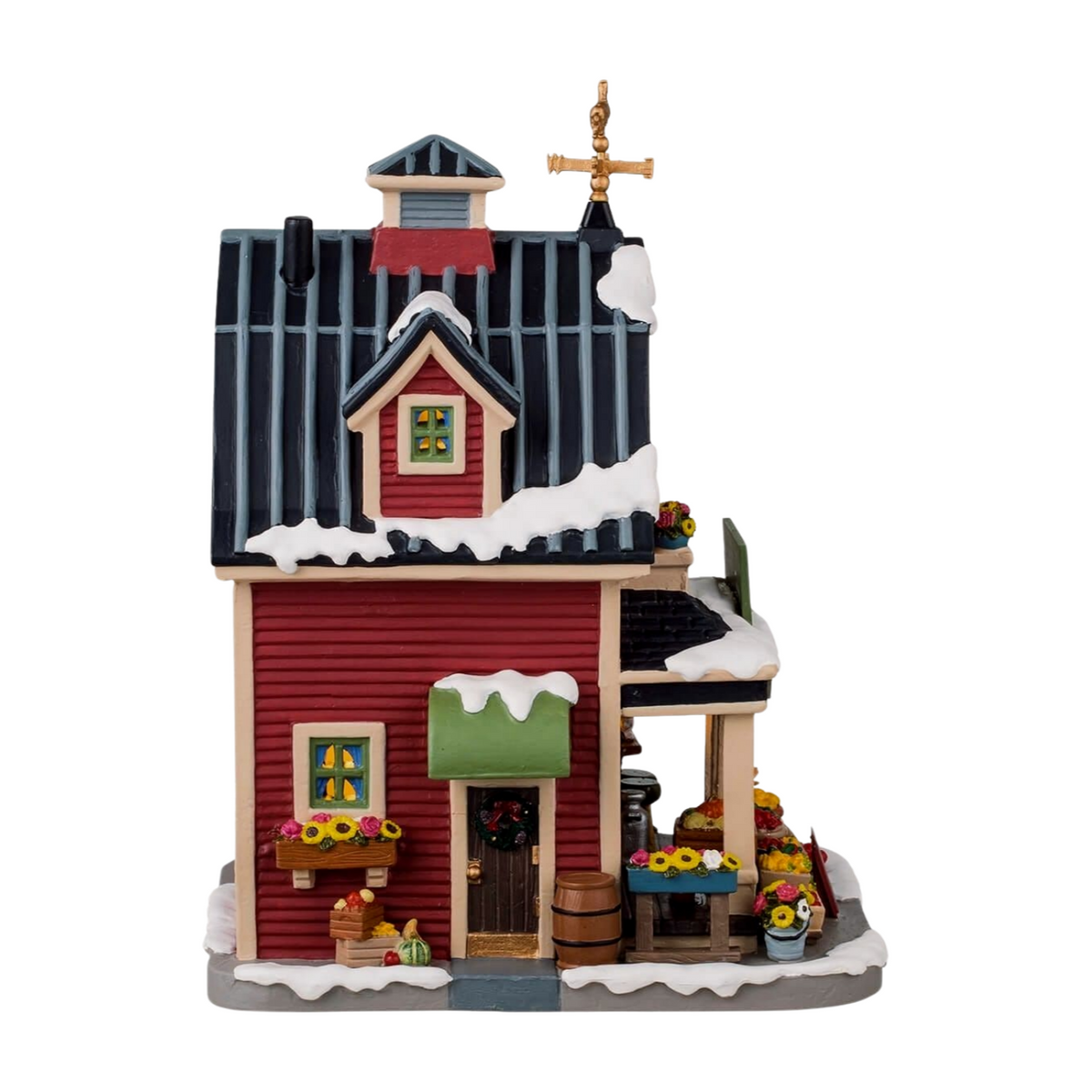 Right view of red farm building Christmas village with flower boxes, wreath on door, weather vane, and produce displays outside