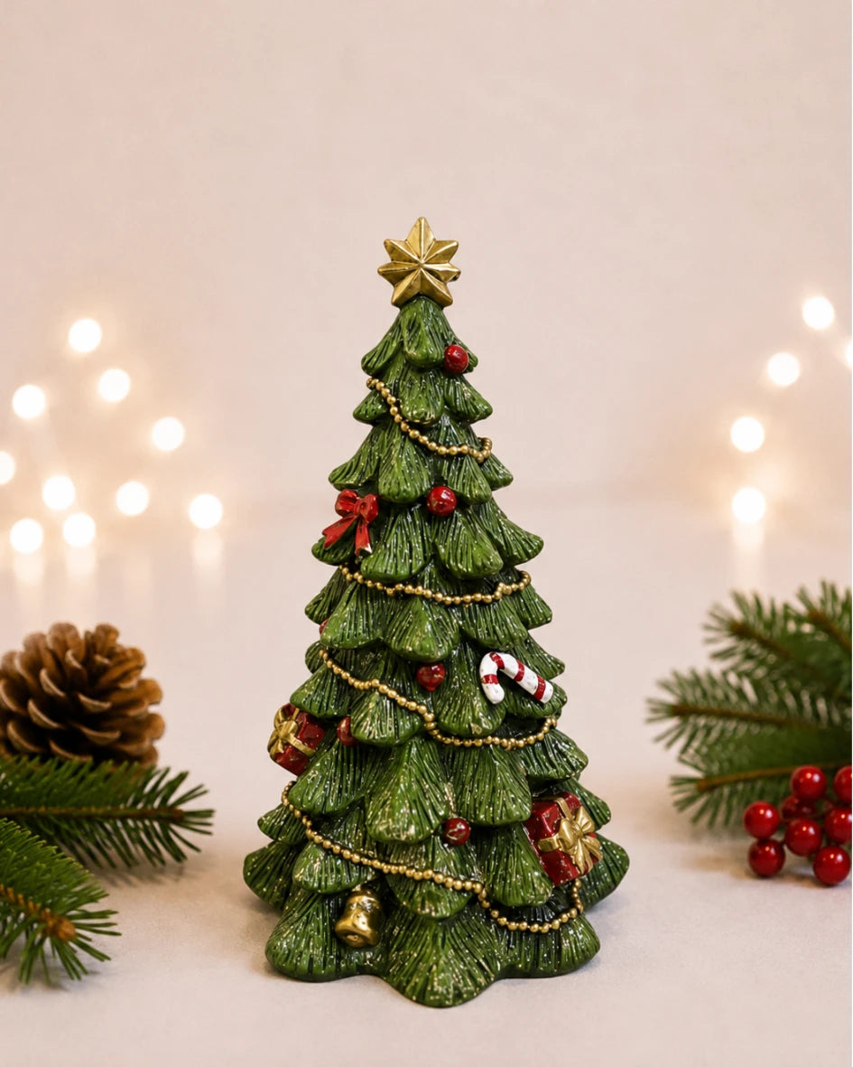 Decorated Christmas tree figure with gold star topper and bauble detail on plain background