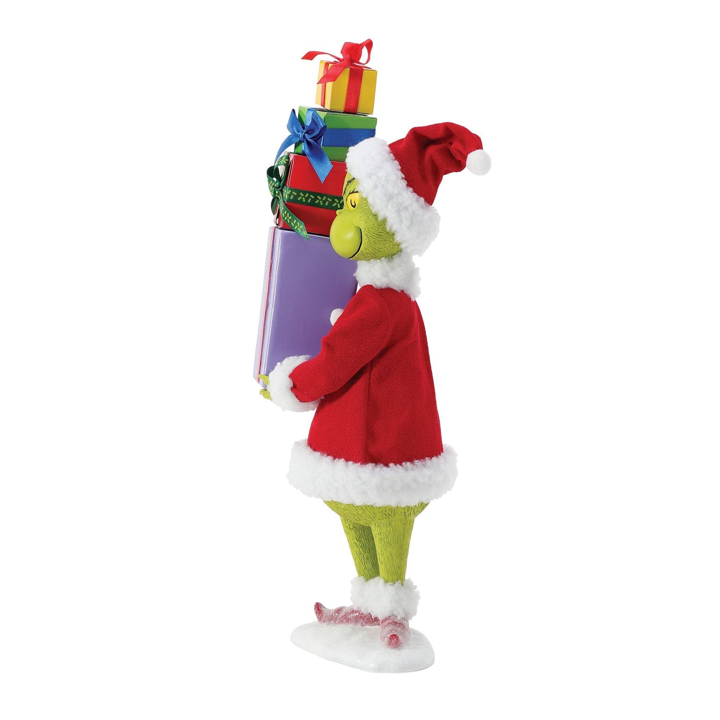 Three-quarter view of Grinch figurine in red Santa suit carrying a stack of four colourful wrapped gifts on a snowy base