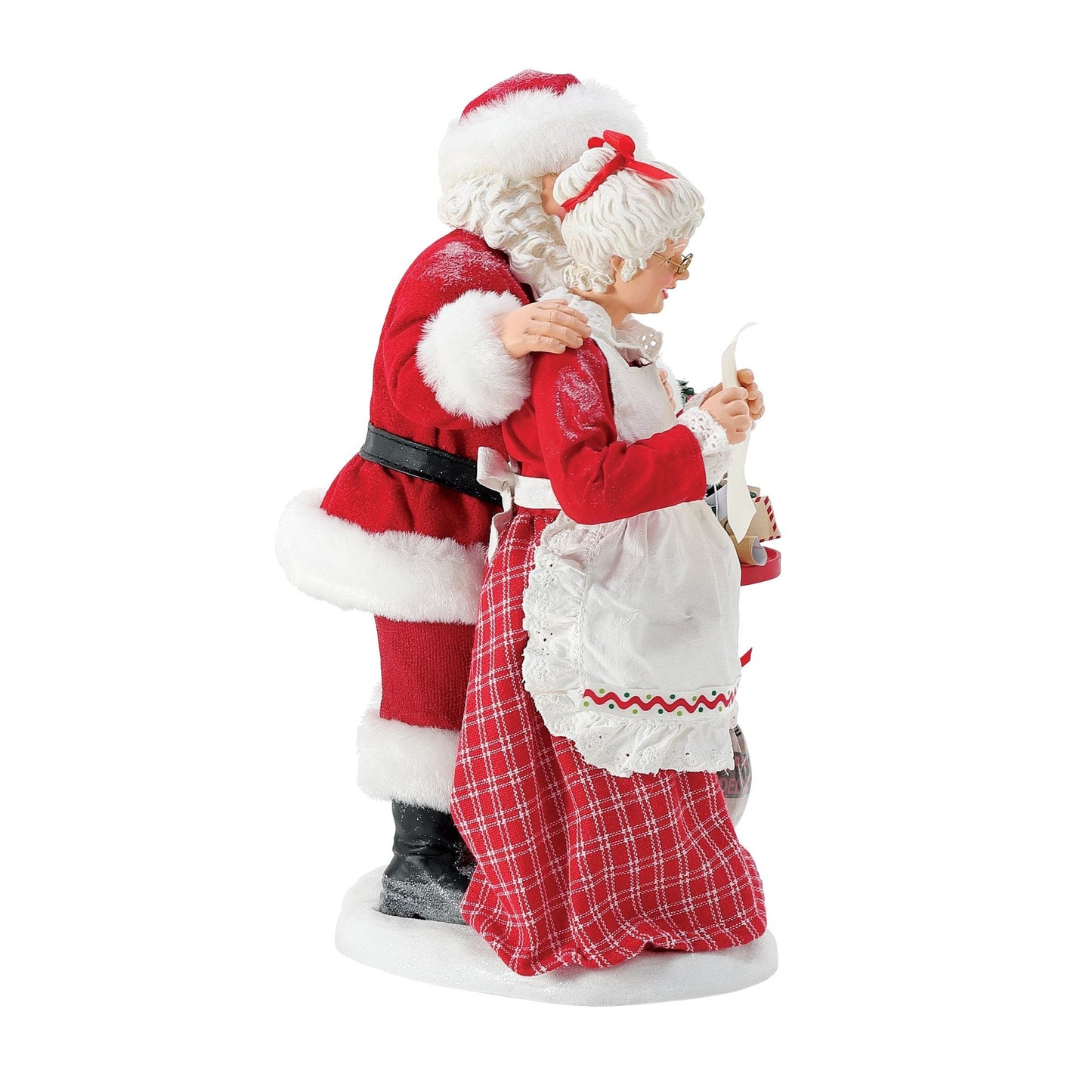 Side view of Mrs. Claus figurine reading a letter at a red mailbox, Santa beside her, "Special Delivery" mail sack and gifts at base