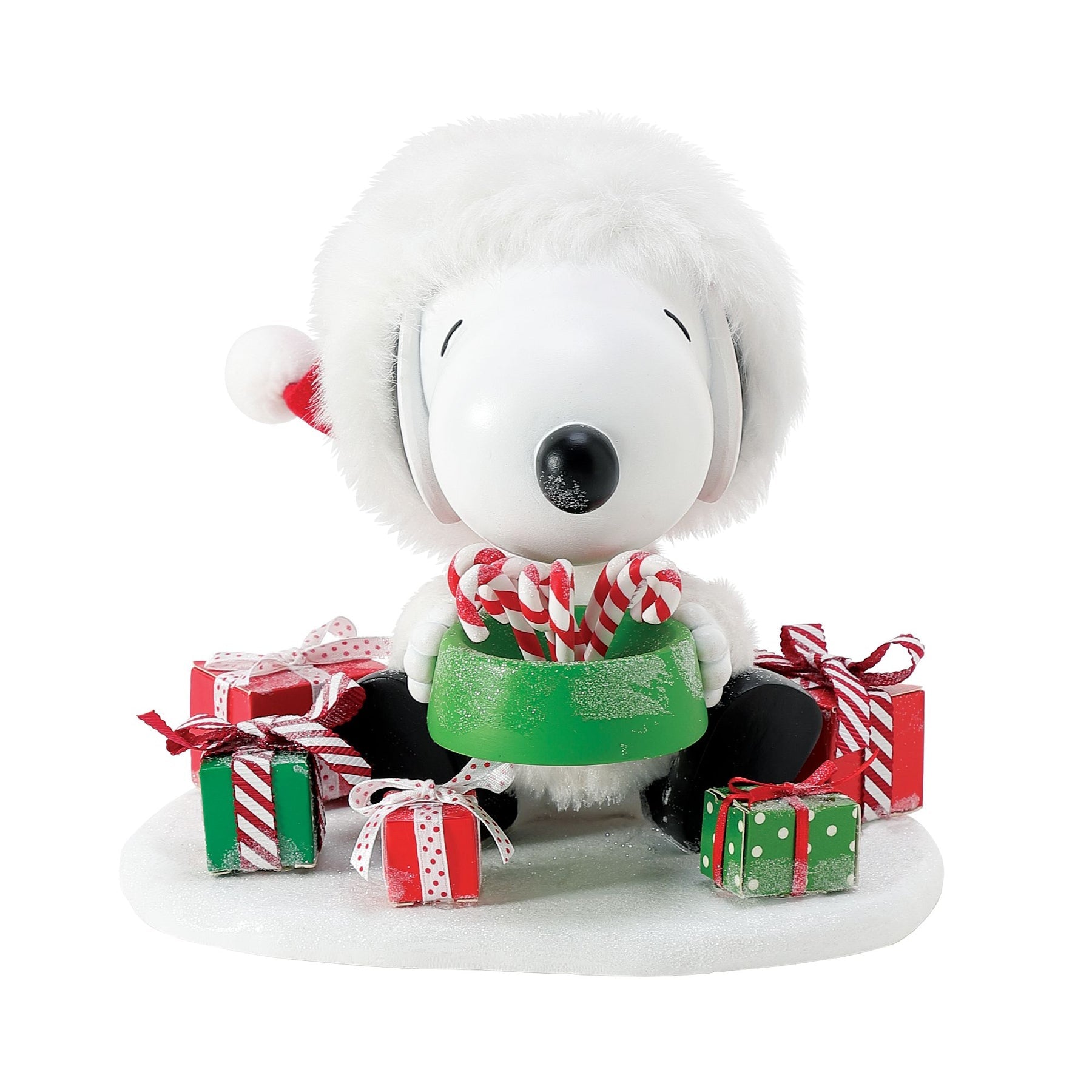 Snoopy figurine in Santa hat holding a green dog bowl of candy canes, surrounded by wrapped red and green gifts