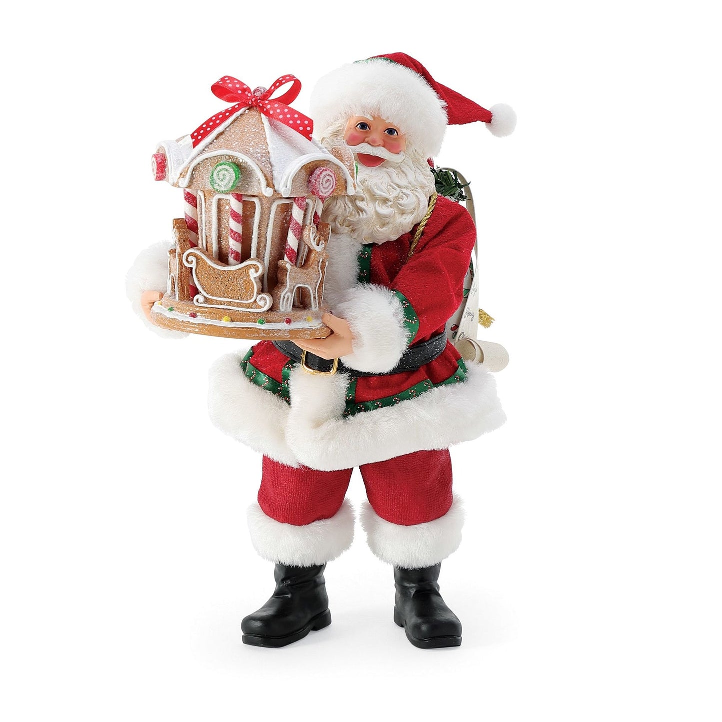Front view of Santa figurine holding a gingerbread carousel decorated with lollipops, candy canes, and a red ribbon bow on top 