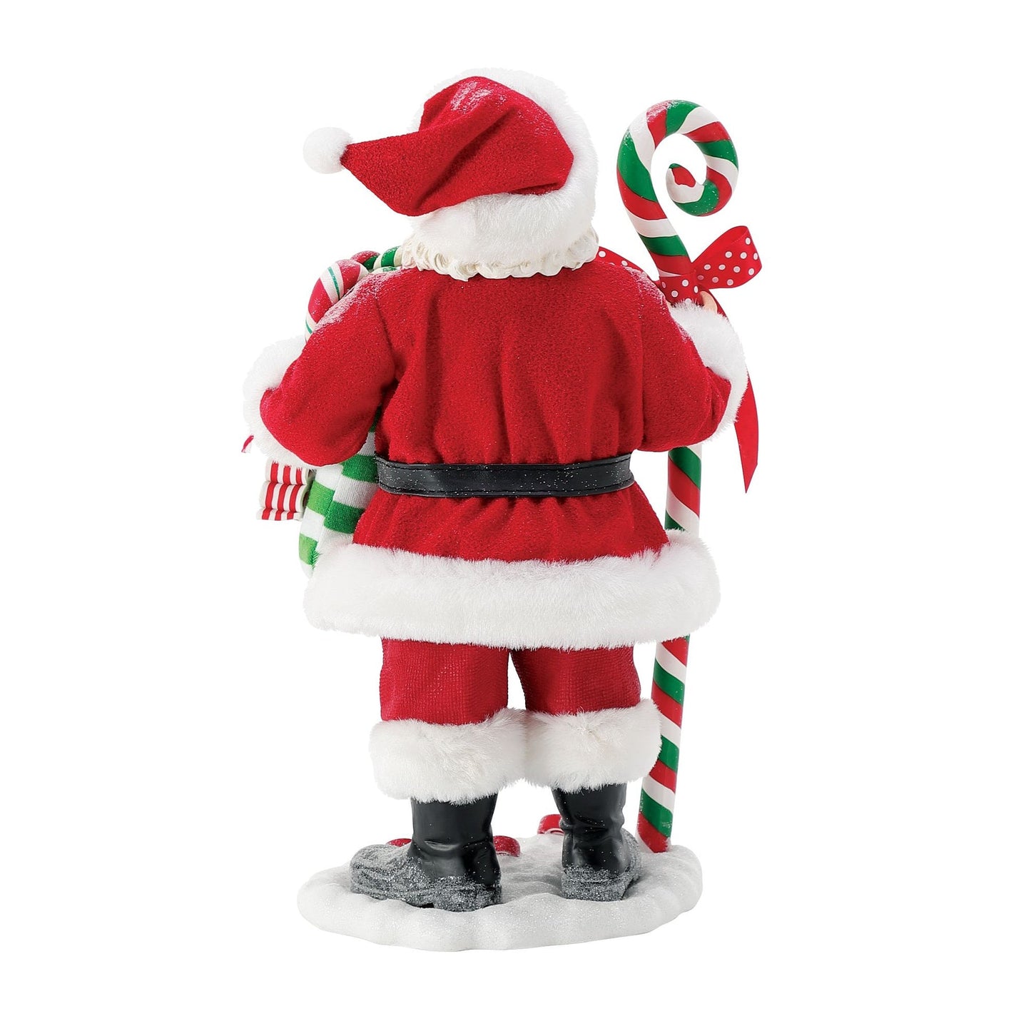 Rear view of Santa figurine beside a tall red and green striped candy cane with polka-dot bow, holding a candy-filled striped stocking