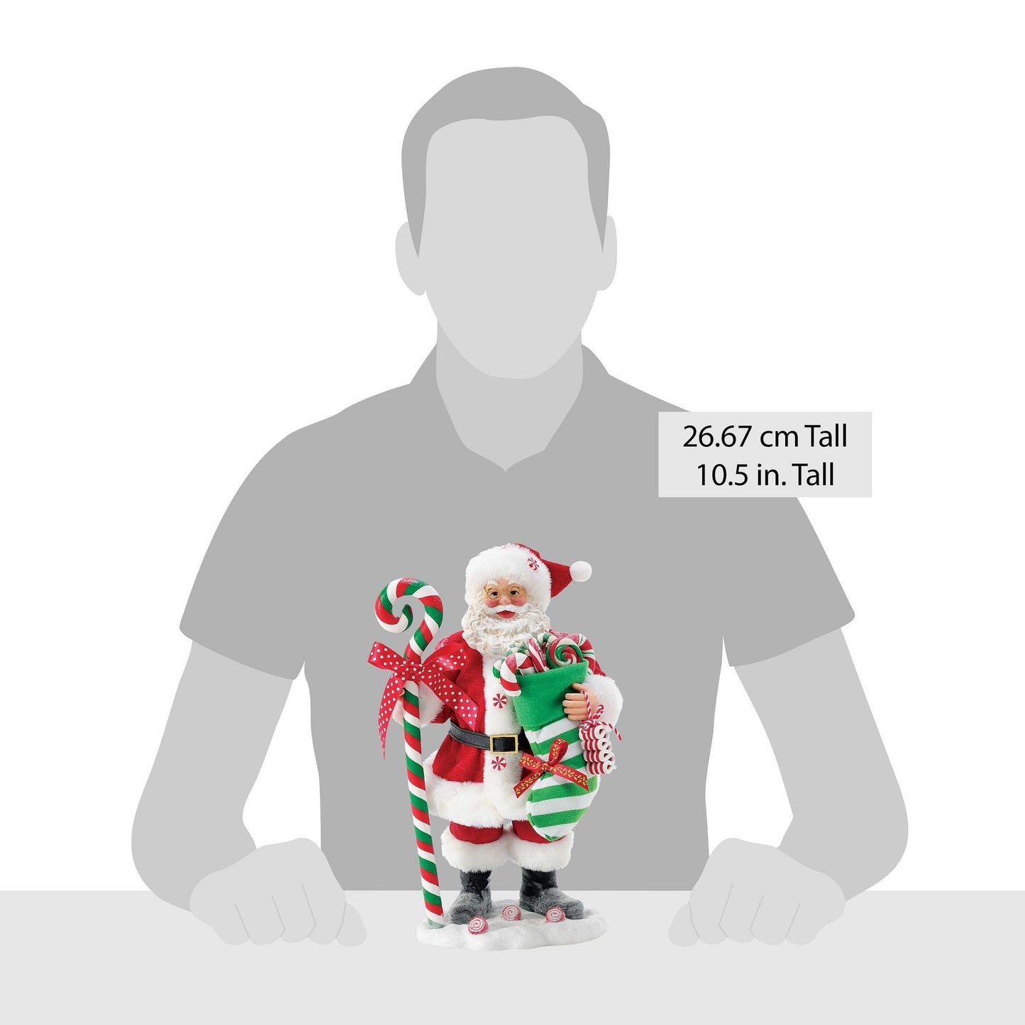 Candy-themed Santa figurine shown against a human silhouette for scale, 26.67 cm / 10.5 inches tall 
