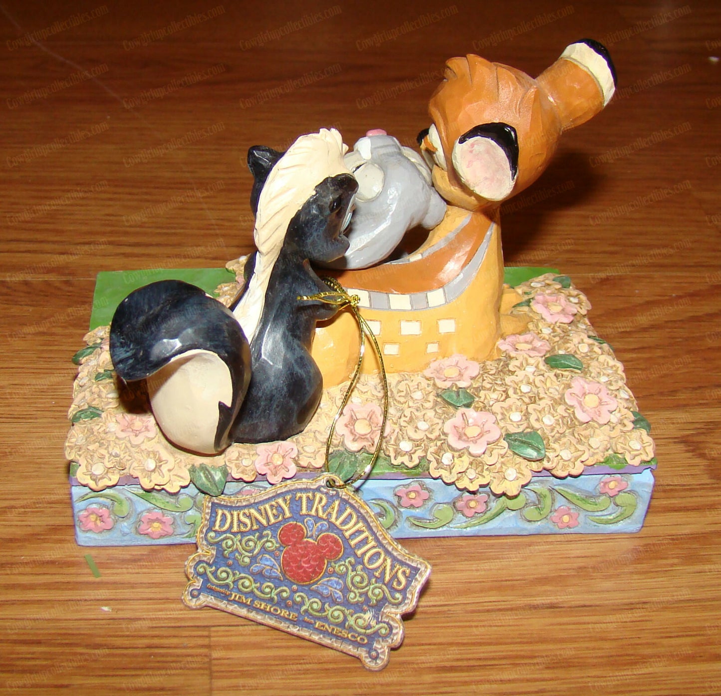 Disney Traditions figurine of Bambi, Thumper and Flower surrounded by painted flowers on a decorative base