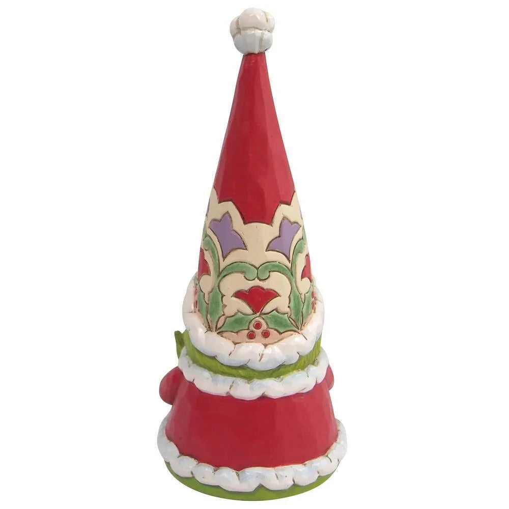 Rear view of a Grinch gnome figurine in a tall red Santa hat with floral scrollwork detail and white fur-trimmed red robe