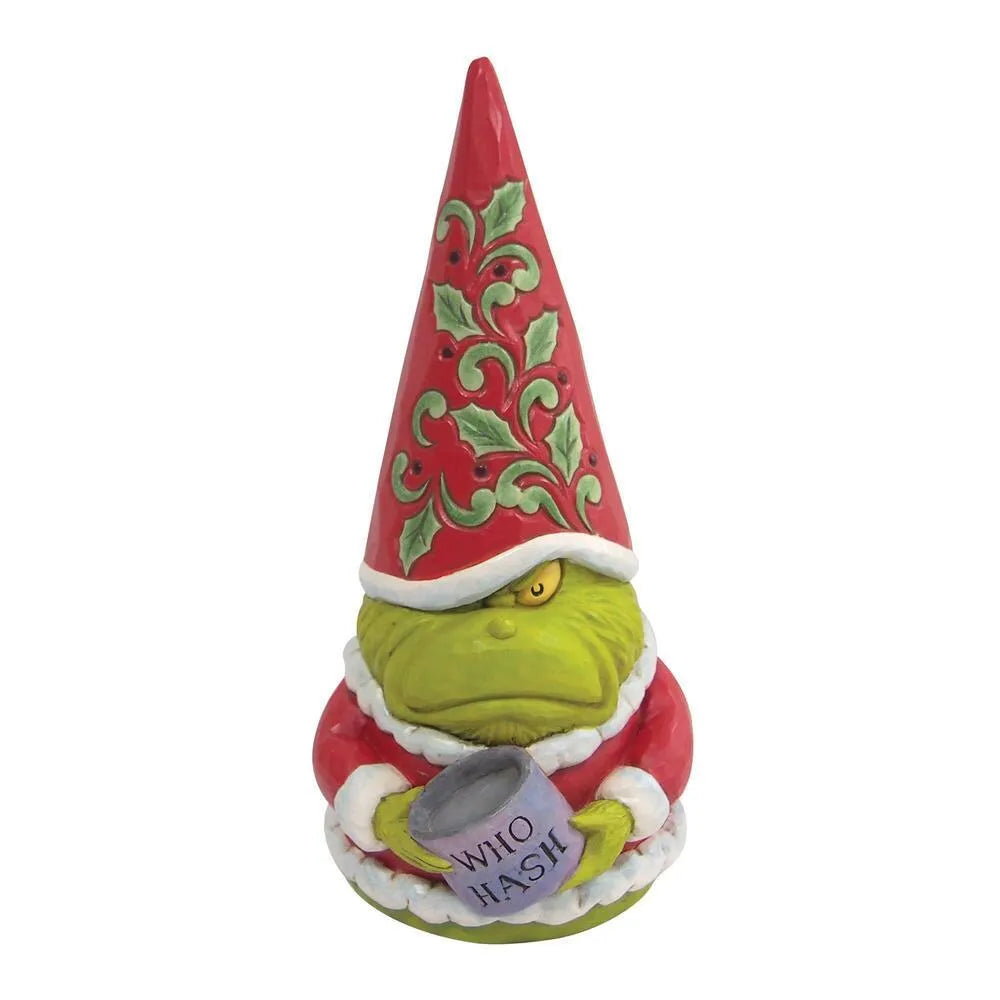 Front view of a scowling Grinch gnome figurine holding a "Who Hash" mug, tall red hat with holly scrollwork detail