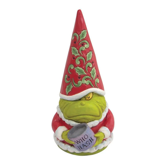 Front view of a scowling Grinch gnome figurine holding a "Who Hash" mug, tall red hat with holly scrollwork detail