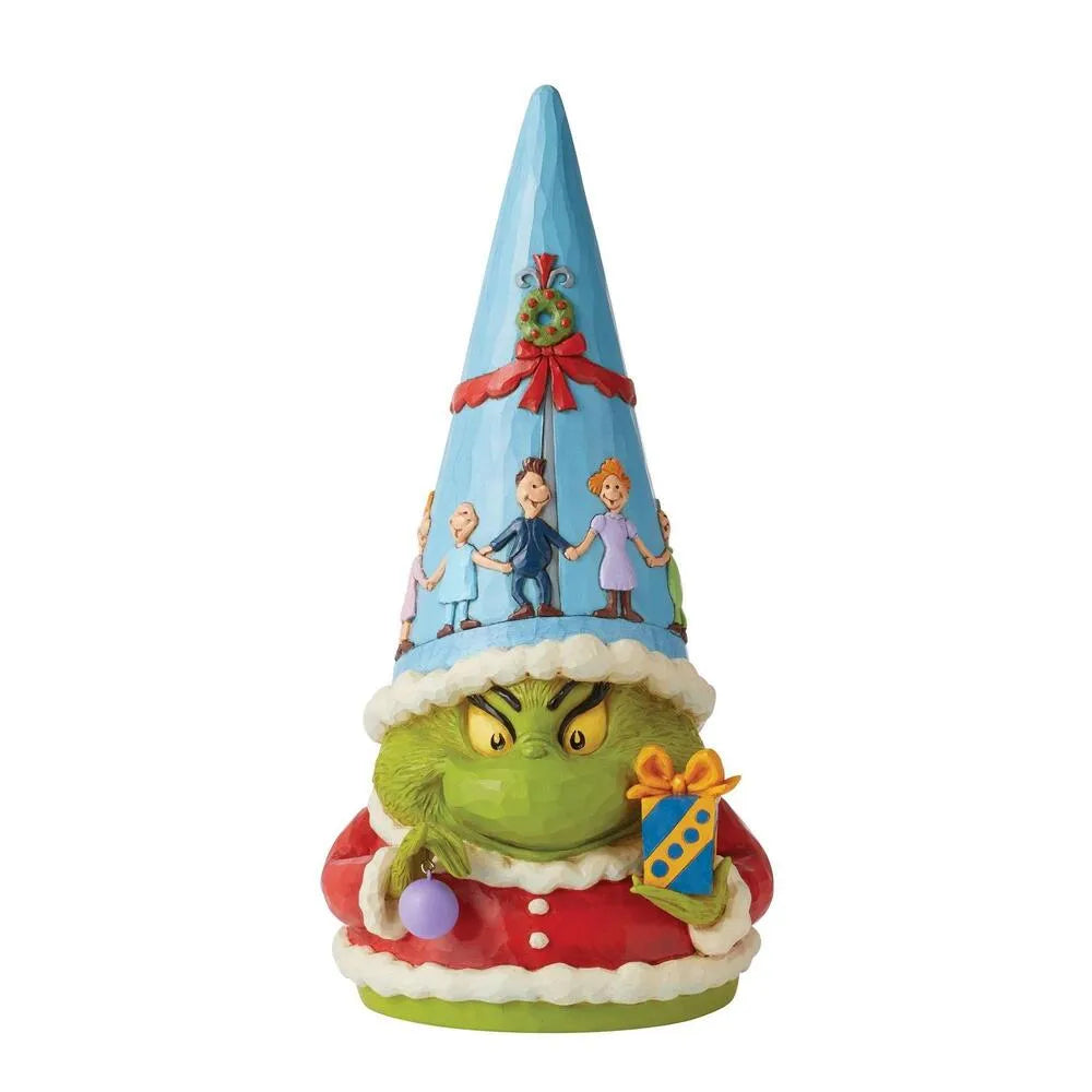 Grinch gnome figurine front view; scowling green face, blue cone hat with wreath, Who characters, holding a wrapped gift