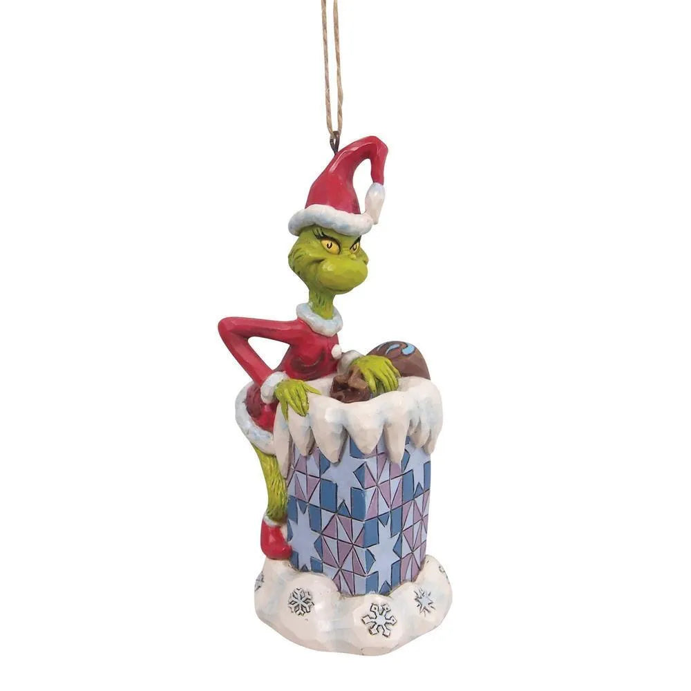 Jim Shore Grinch climbing into a chimney hanging ornament, Santa hat, snowflake-patterned chimney with snow and icicle details