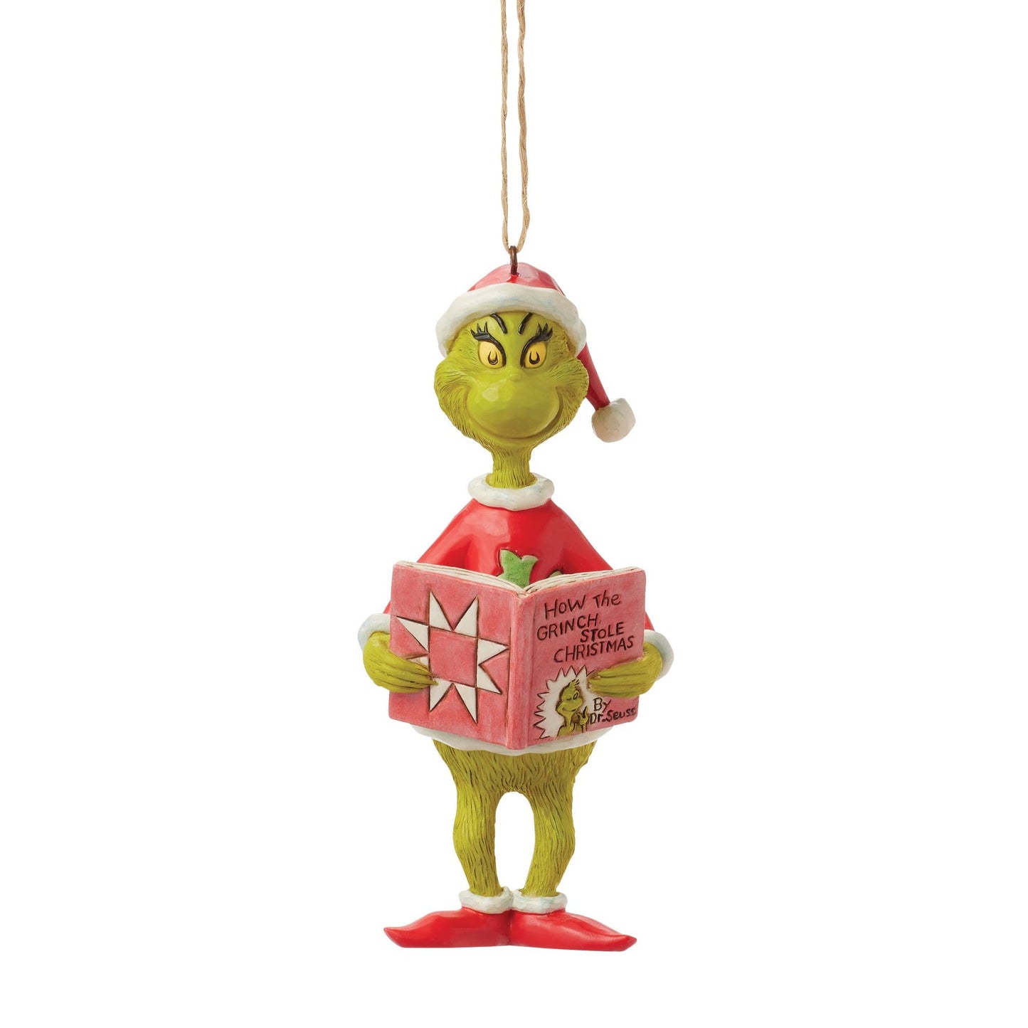 Grinch hanging ornament facing forward in Santa hat, holding open How the Grinch Stole Christmas book, twine hanger