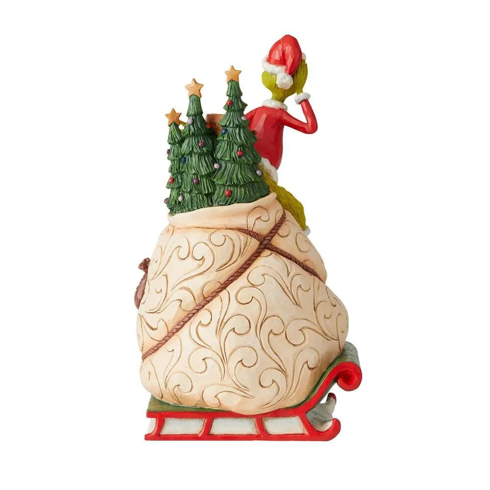 Rear view of Grinch sleigh figurine showing scrollwork sack detail, Christmas trees and Grinch in Santa suit