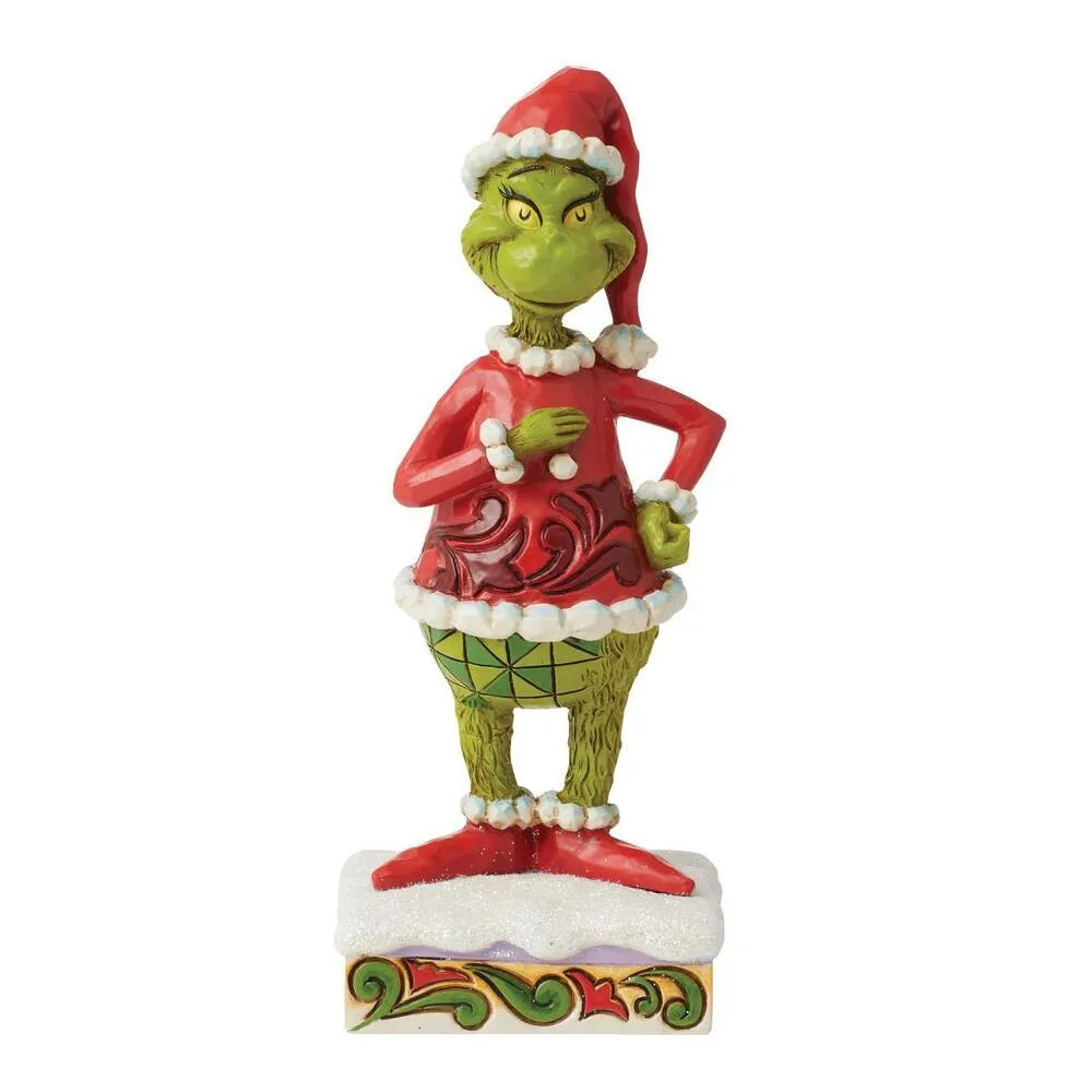 Front view of Grinch figurine in Santa hat and red scrollwork coat, hands on hips, scowling expression, snowy scrollwork base 