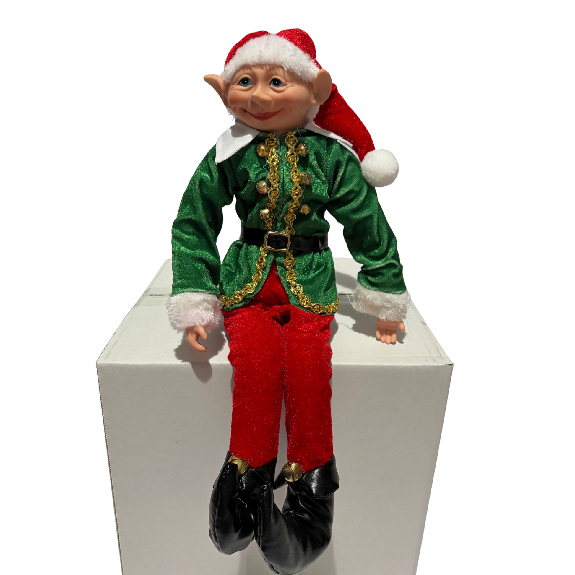 Sitting Christmas elf in green jacket and red trousers with a red hat and black boots