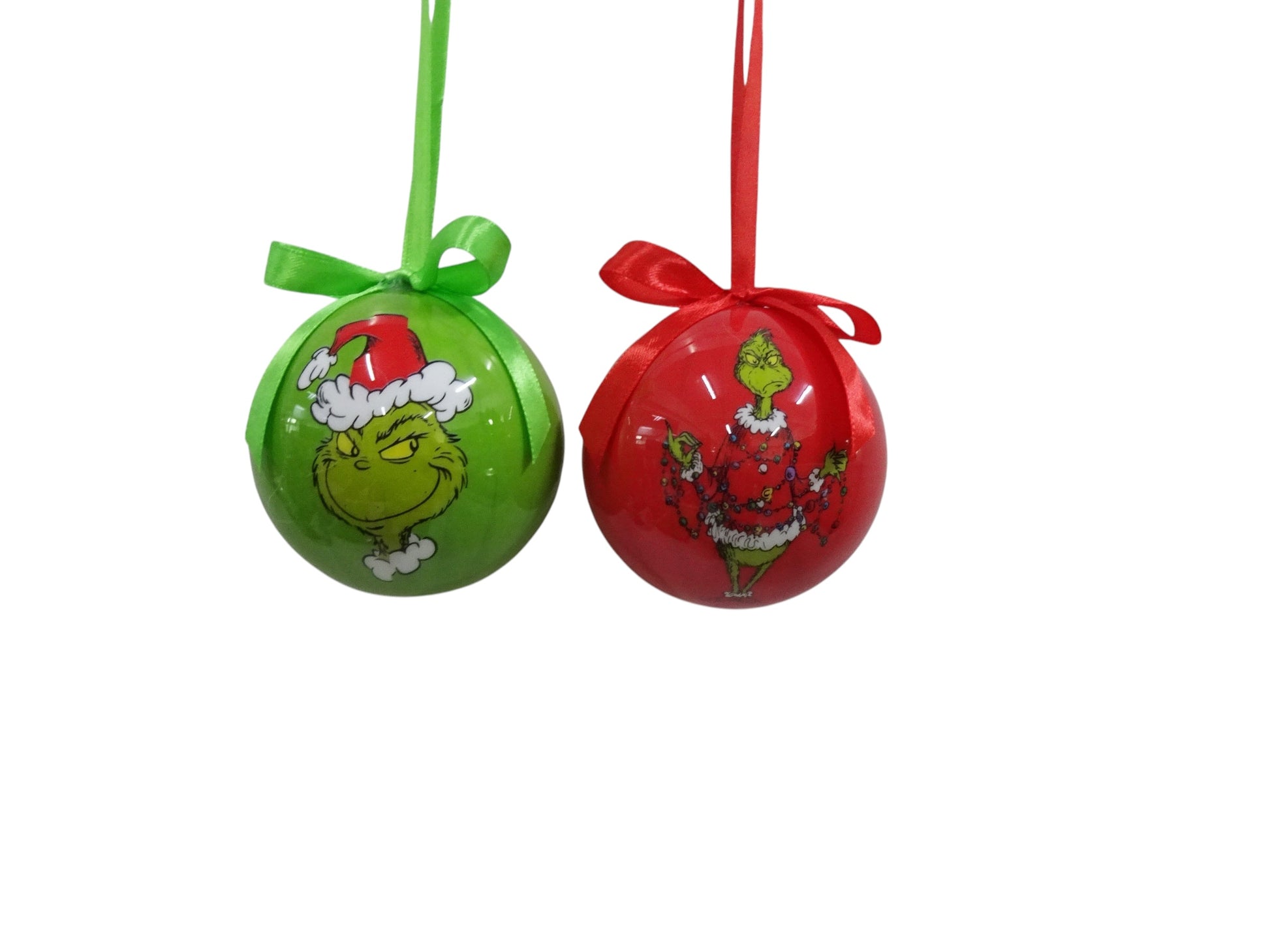Two Christmas ornaments, one green and one red, with festive designs on a white background.