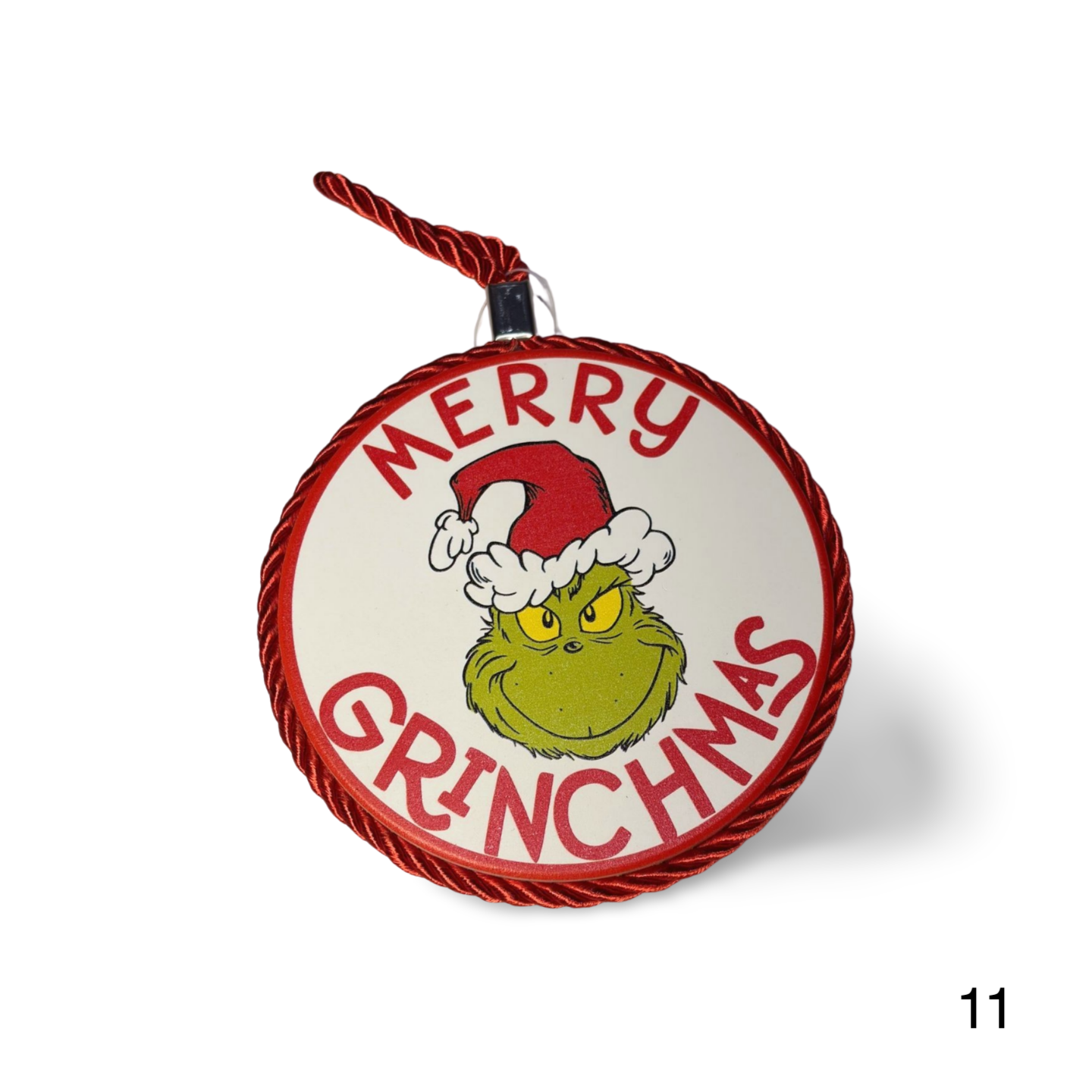 Christmas ornament with Grinch face and 'Merry Grinchmas' text on a white background