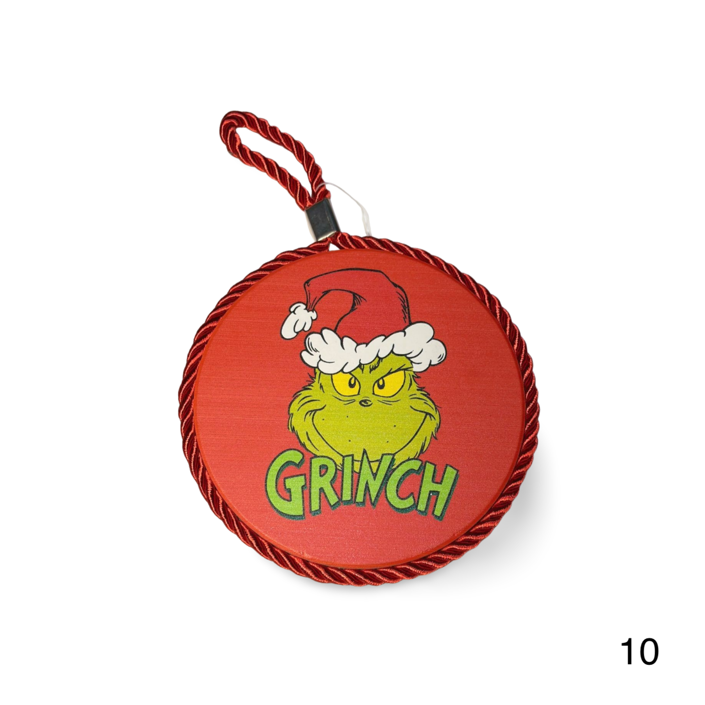 Red ornament with Grinch face and Santa hat on a white background