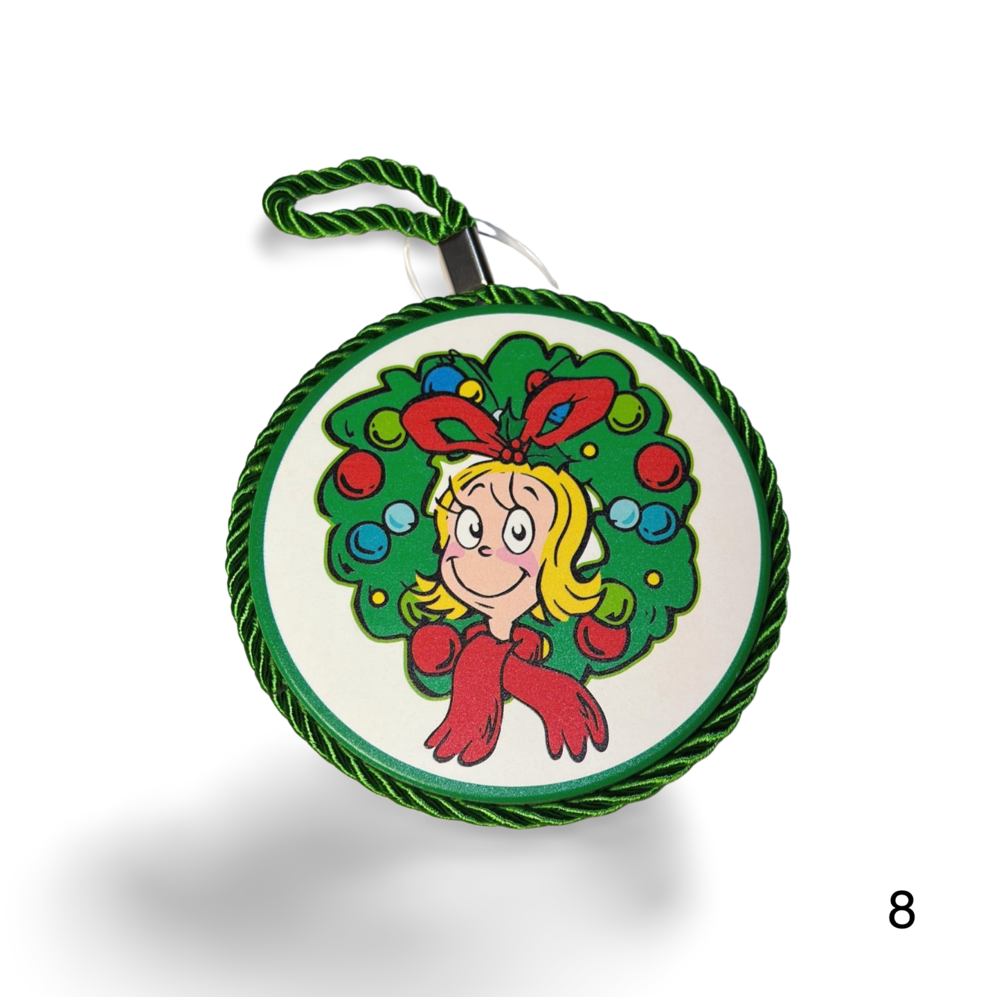 Decorative ornament with a cartoon character in a wreath on a white background