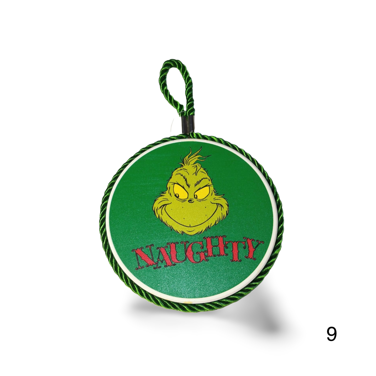 Green and white round tag with a character face and 'Naughty' text on a white background