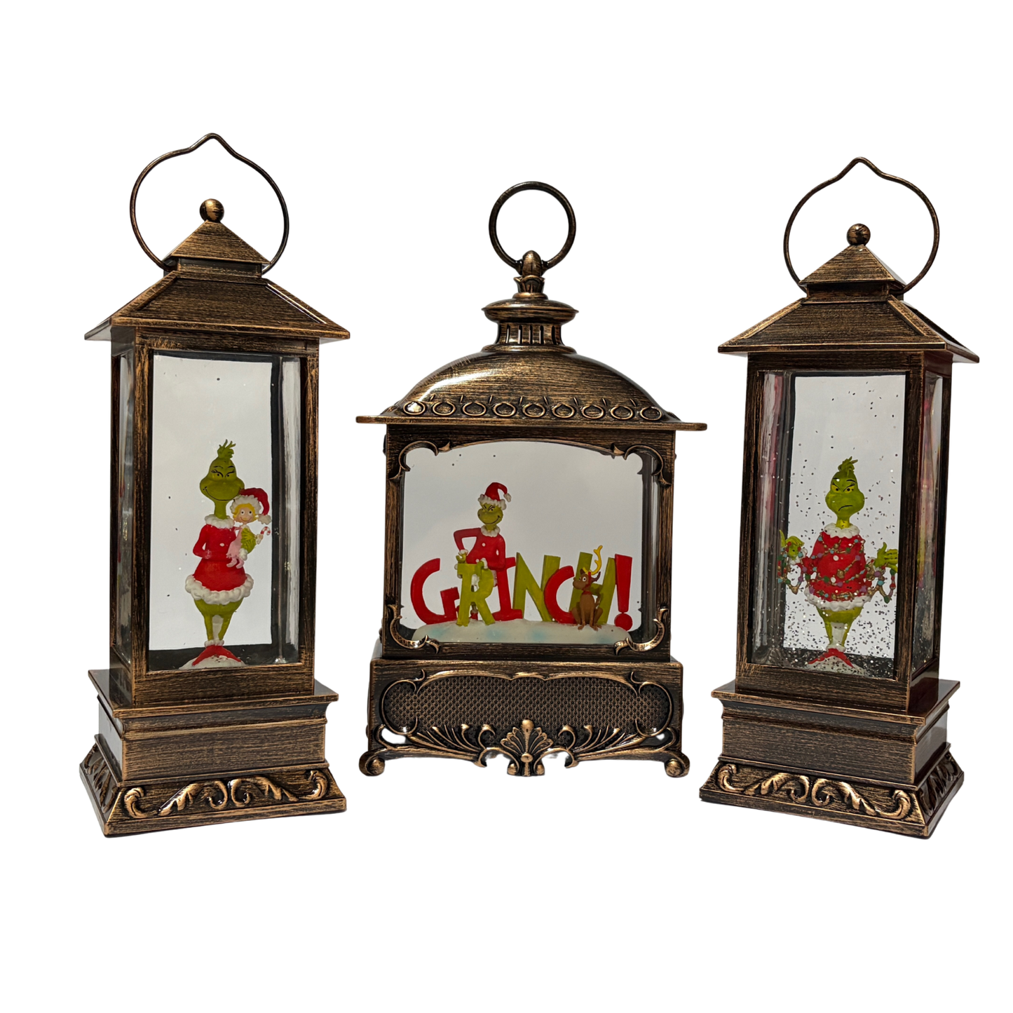 Set of three decorative lanterns with Grinch-themed designs on a white background