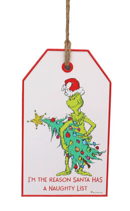 Door hanger featuring the Grinch in a Santa hat holding a Christmas tree with text reading “I’m the Reason Santa Has a Naughty List”