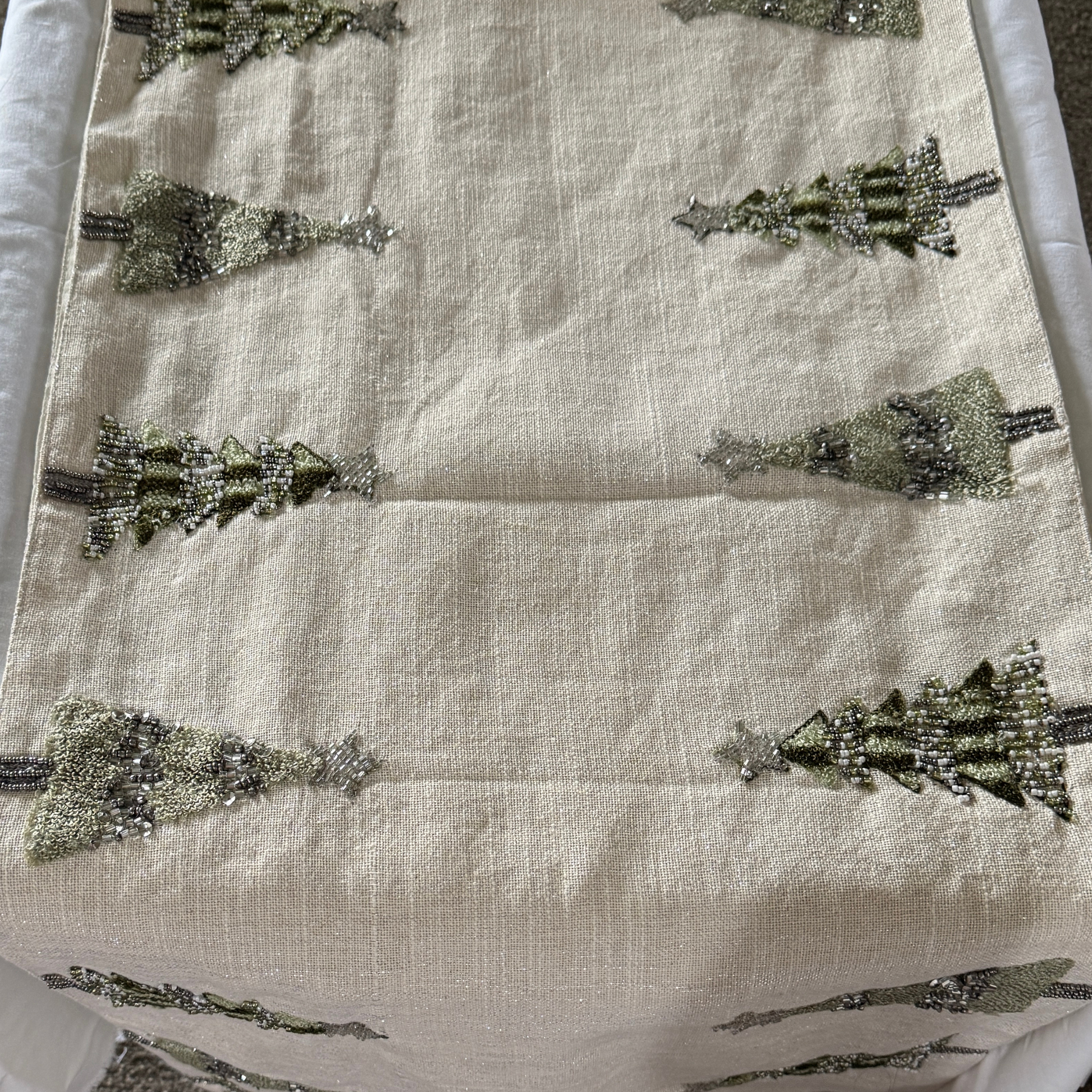 Hand-beaded cream table runner with green and silver Christmas tree design