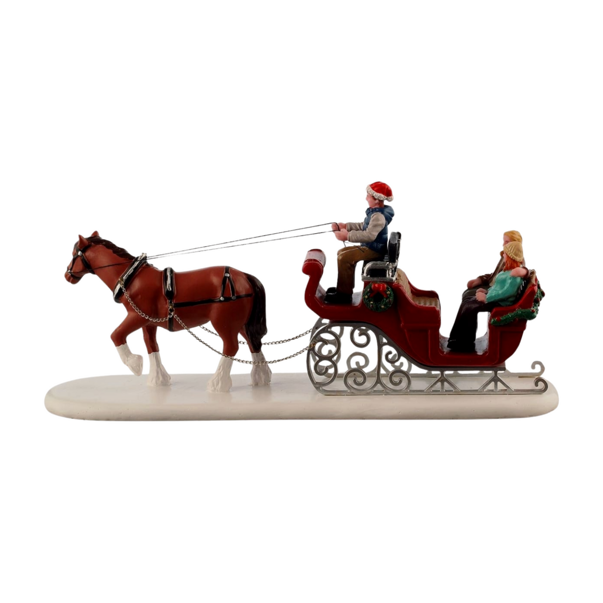 Side view of Christmas village horse-drawn sleigh figurine with brown horse, scrollwork sleigh runners, driver, and two passengers 