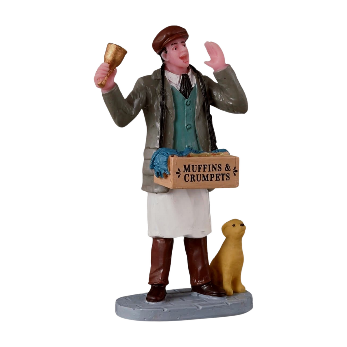 Christmas village figurine of a Victorian muffin seller ringing a bell, carrying a crate labelled Muffins and Crumpets, with a dog