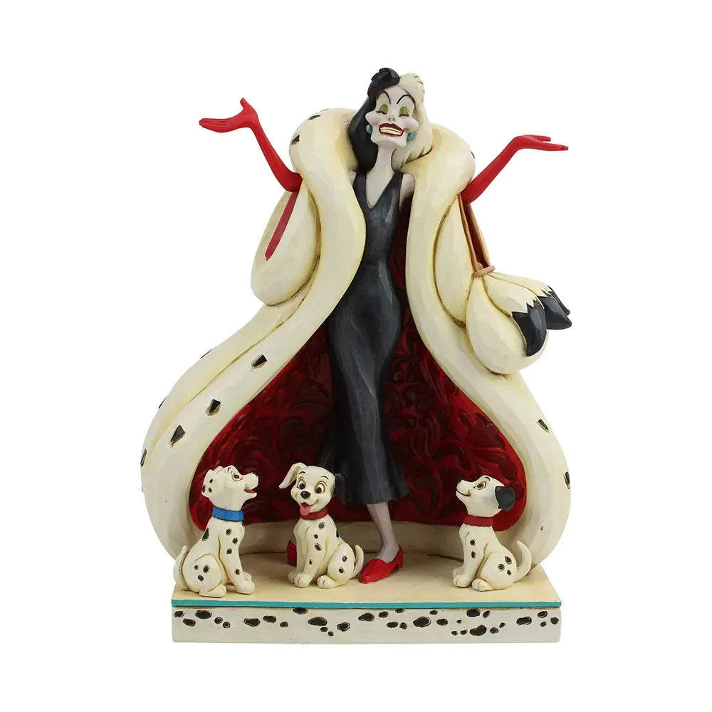 Cruella De Vil figurine front view, arms raised, spotted coat with red scrollwork lining, three Dalmatian puppies at her feet