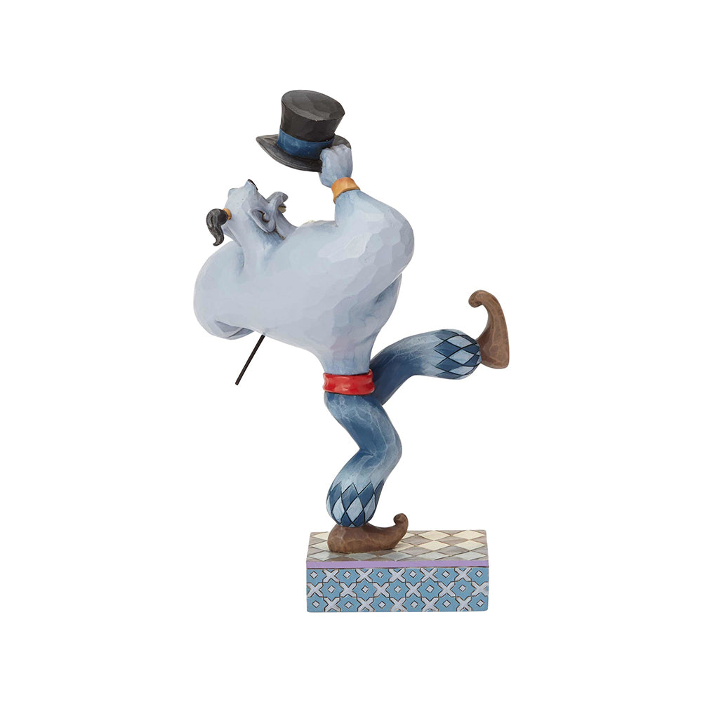 Genie from Aladdin figurine rear view, dancing pose with top hat raised, diamond patterned legs, on a geometric painted base