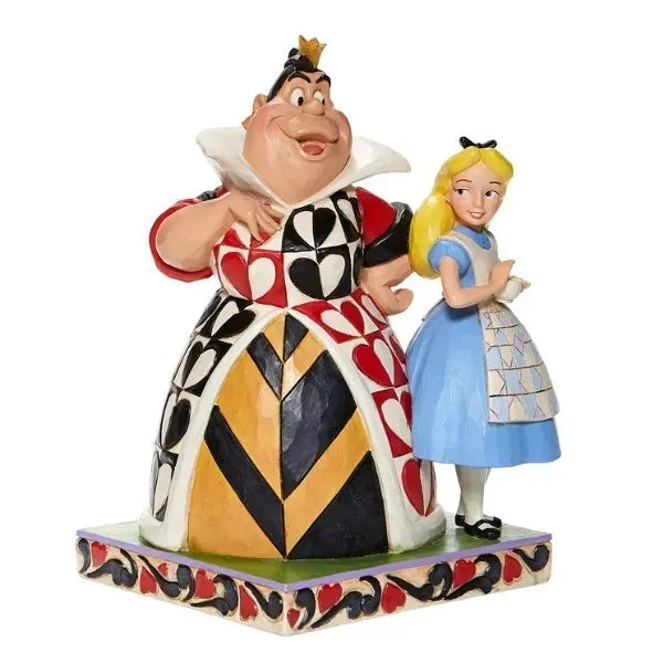 Alice in blue dress beside the Queen of Hearts in bold heart-patterned gown, on a heart-scroll decorated base