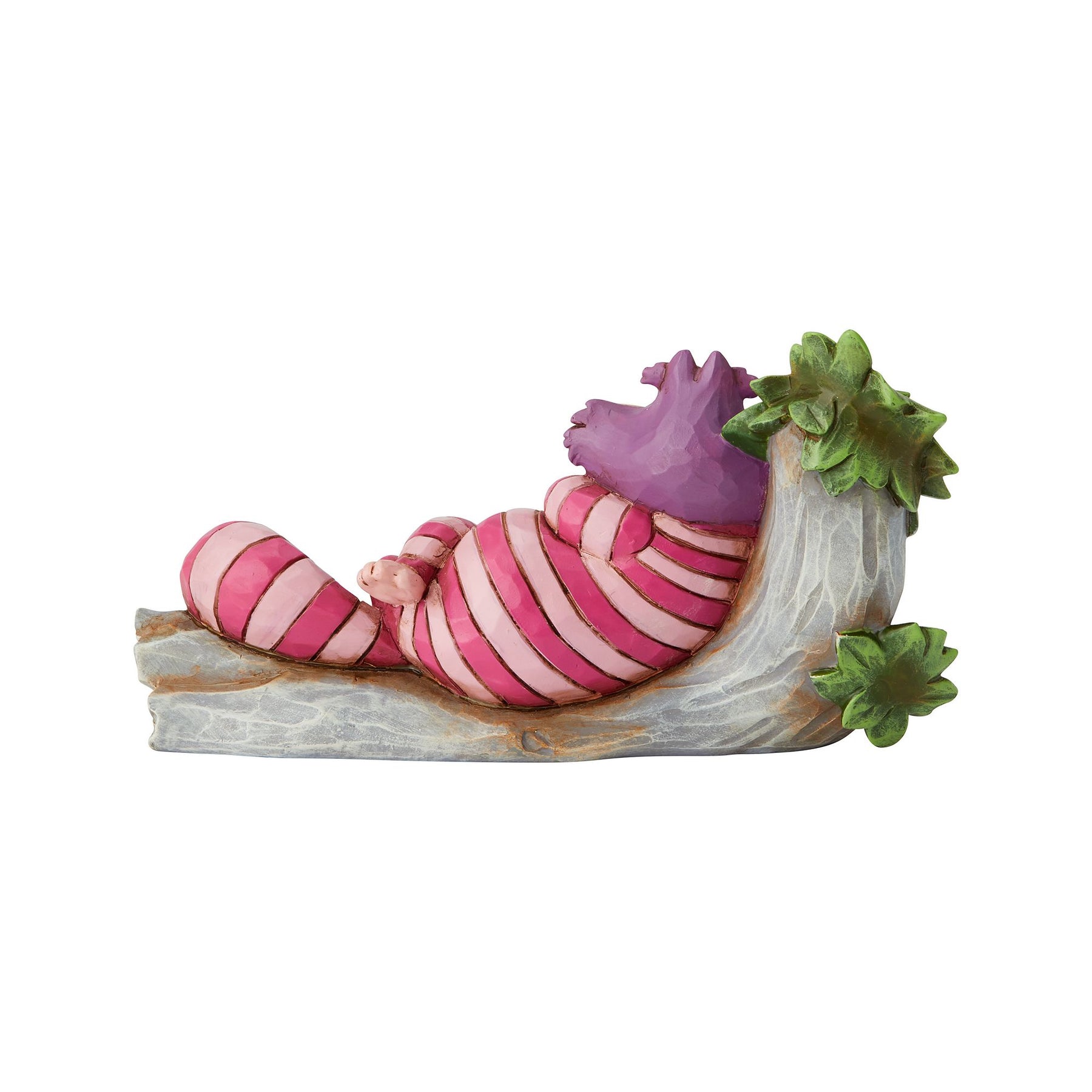 Cheshire Cat figurine rear view, grinning while lounging on a painted log with green foliage and blue scrollwork base