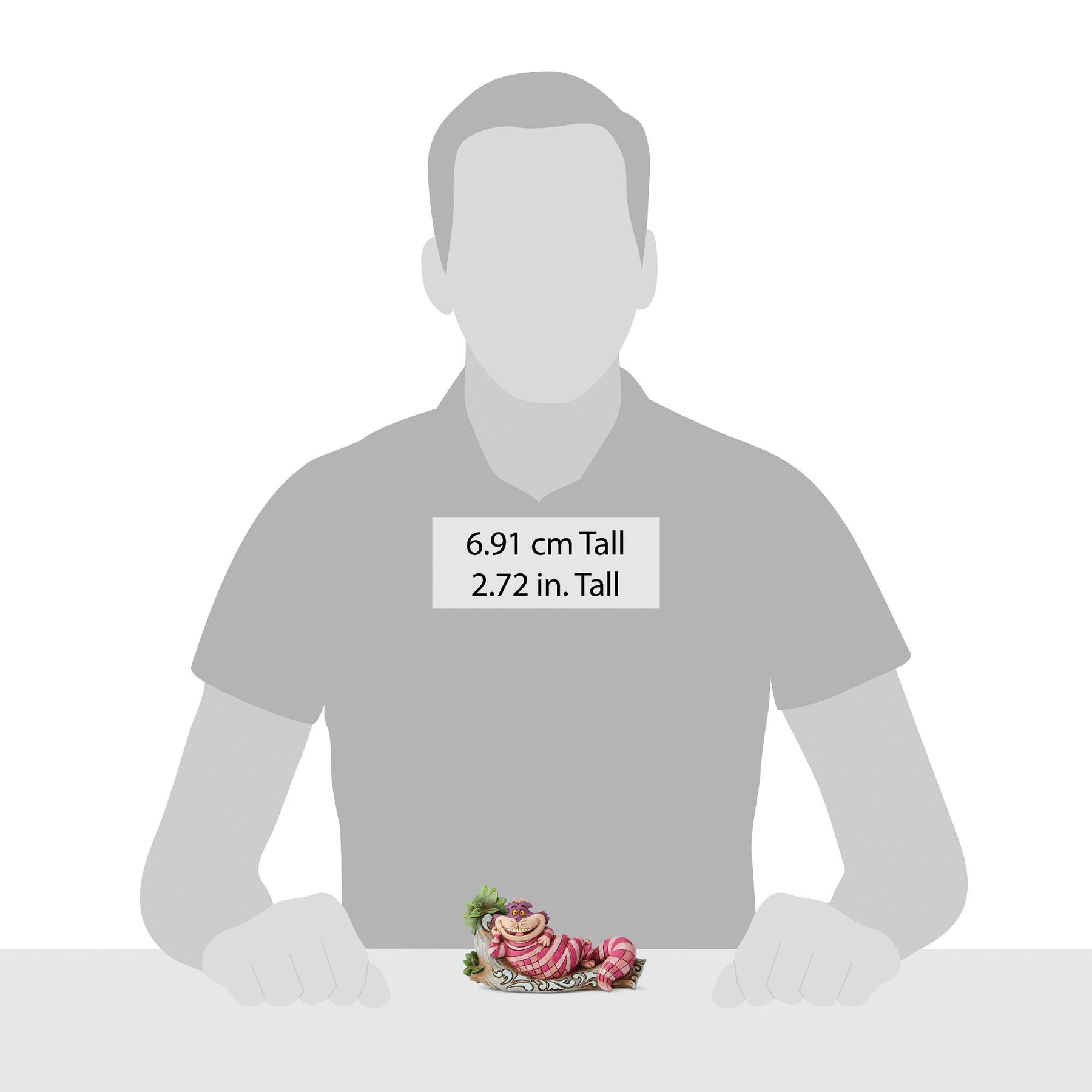 Size reference showing Cheshire Cat log figurine beside a human silhouette, labelled 6.91 cm / 2.72 inches tall 