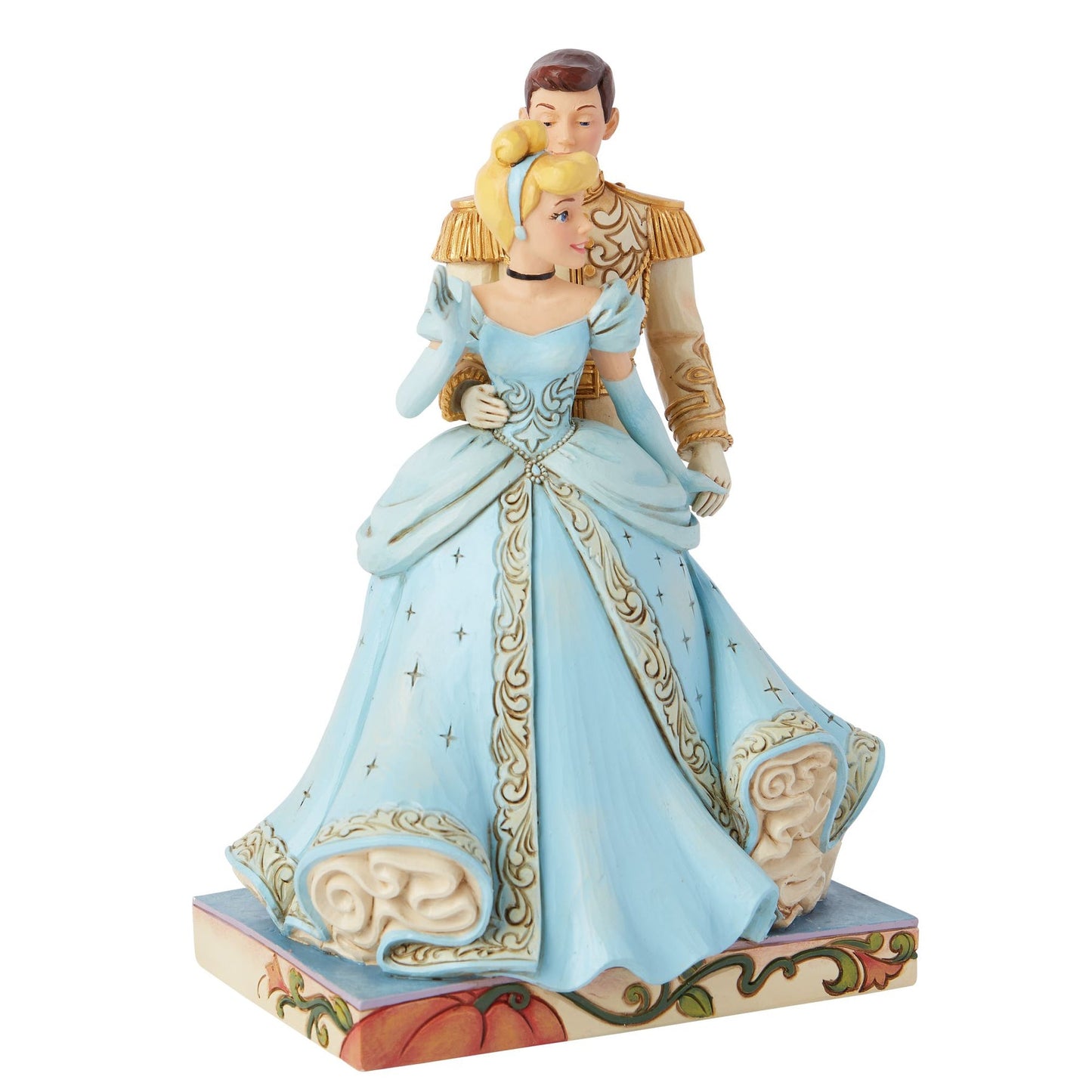 Left view of Cinderella and Prince Charming figurine, blue ball gown with gold scrollwork trim, pumpkin painted base 