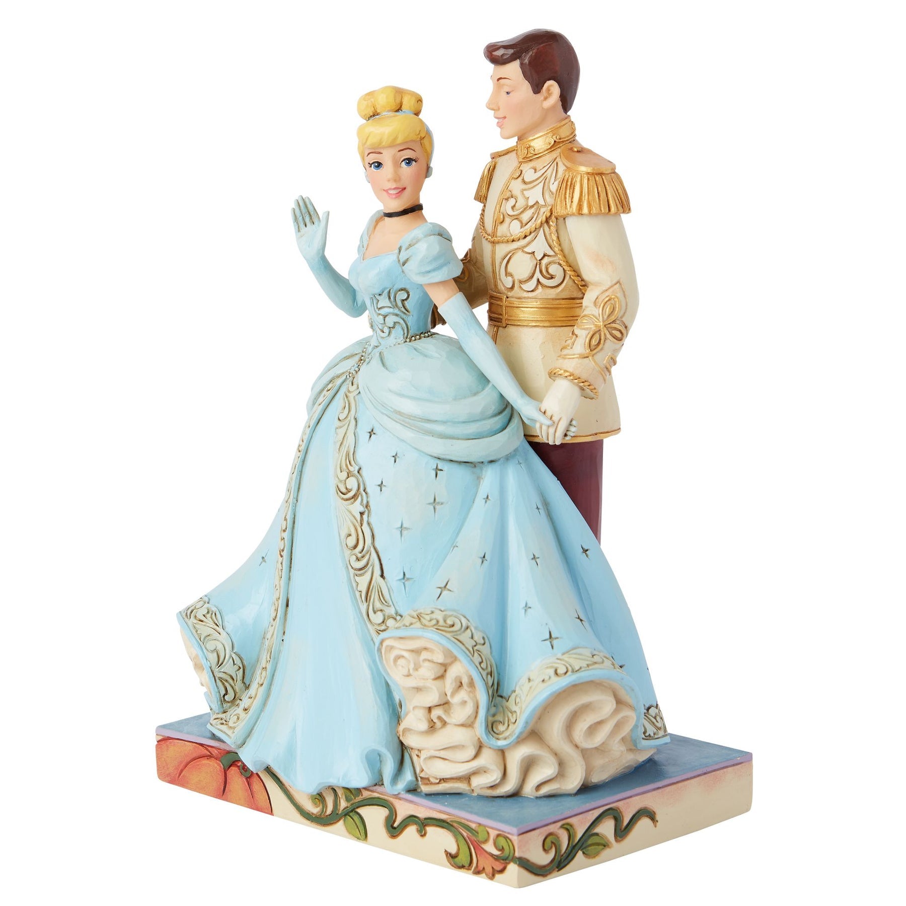 Right view of Cinderella and Prince Charming figurine, sweeping blue ball gown with gold scrollwork, pumpkin painted base