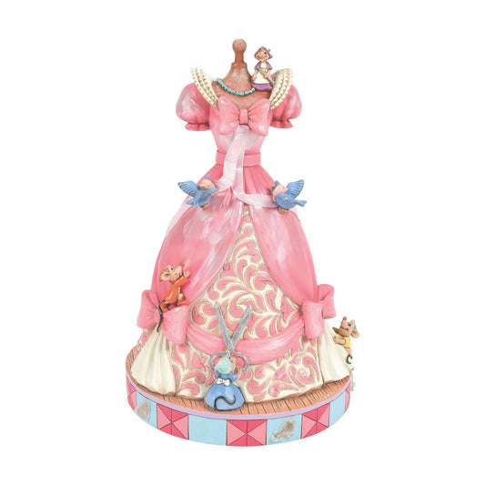 Front view of Cinderella pink ball gown on mannequin with mice, bluebirds, scissors detail, scrollwork skirt, pink and blue base