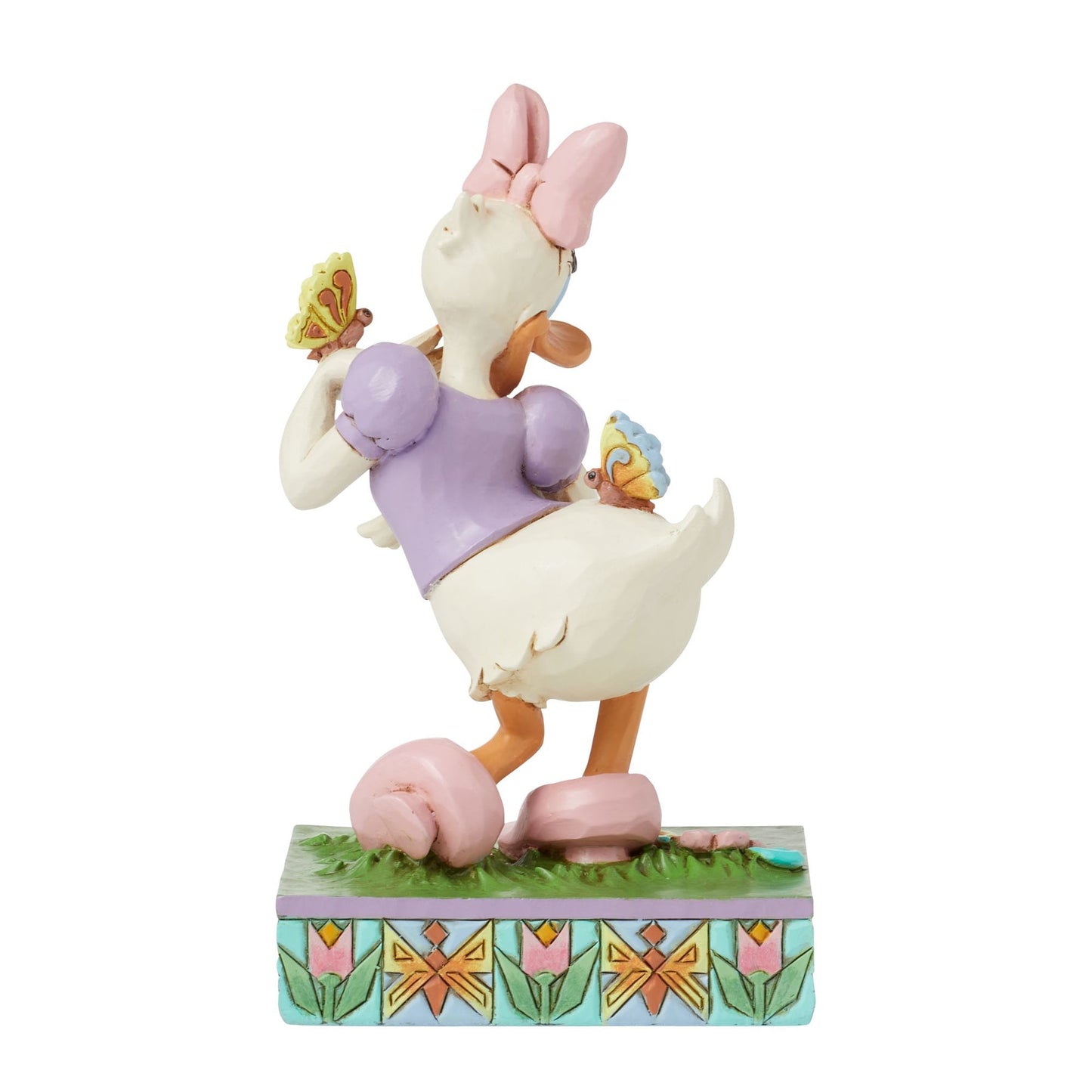 Rear view of Daisy Duck spring figurine, pink bow, purple top, teal bracelet, floral tulip painted base 