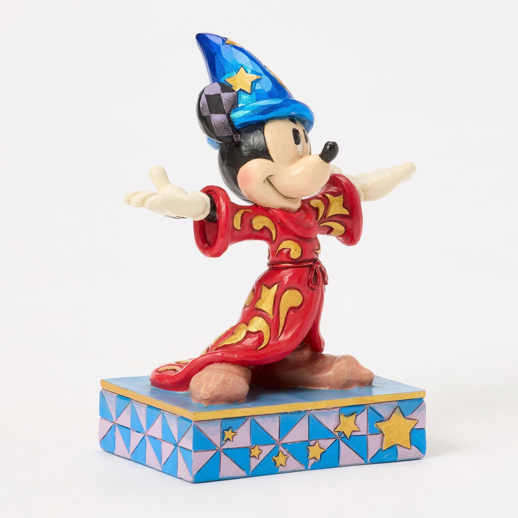 Front view of Sorcerer Mickey Mouse figurine in red and gold scrollwork robe, blue star hat, star painted base