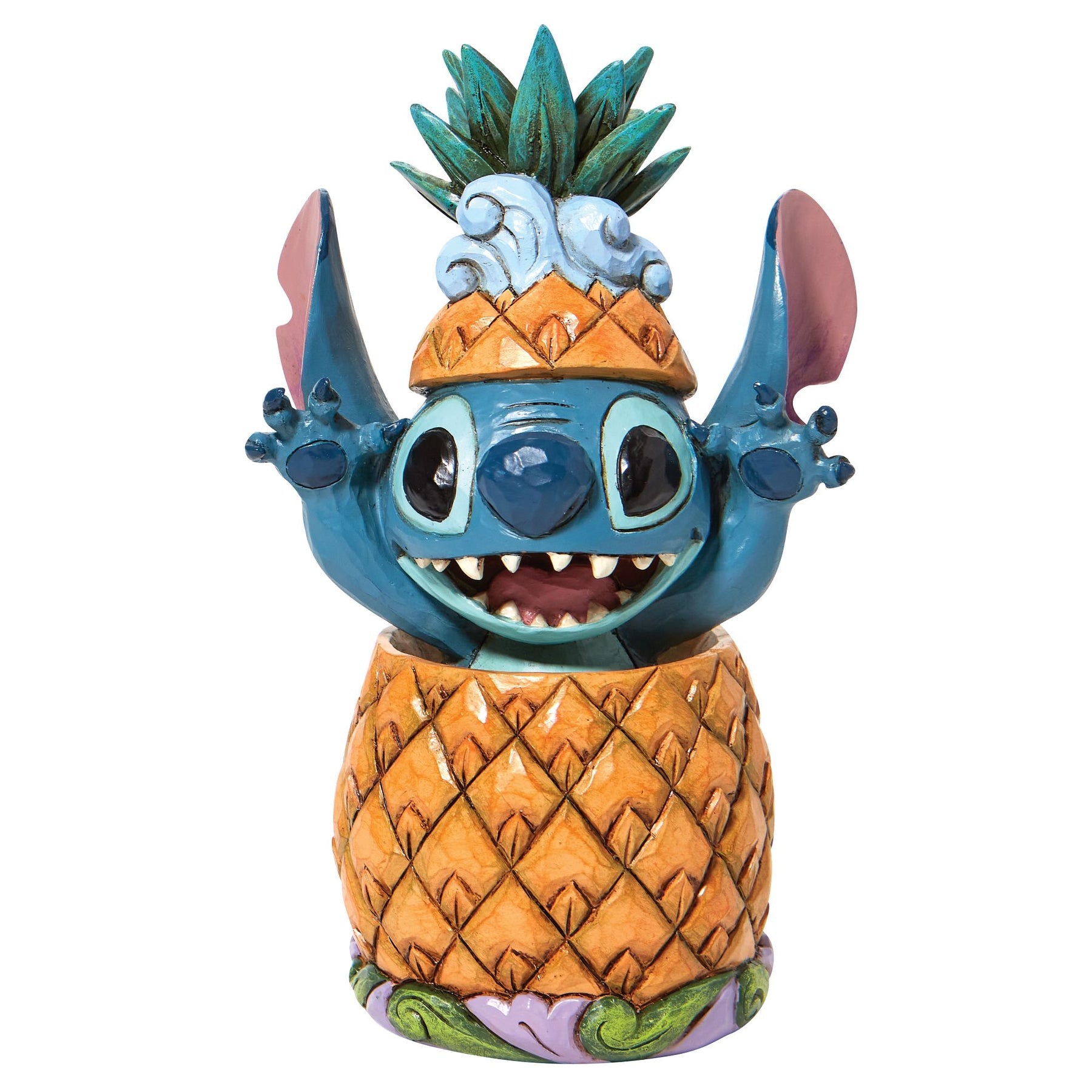 Stitch figurine grinning inside a pineapple with pineapple crown on head, arms raised, on a scroll-decorated base
